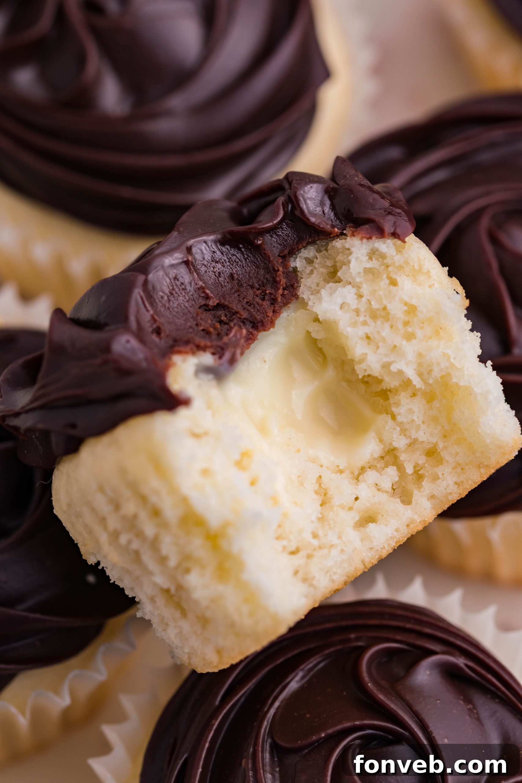 Boston Cream Cupcakes with a bite take out