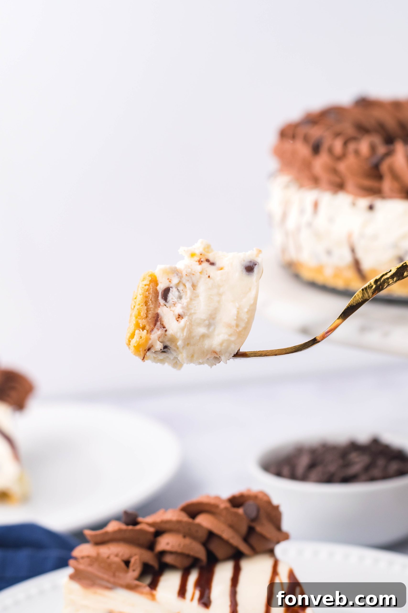 Chocolate Chip Cheesecake bite on a gold fork