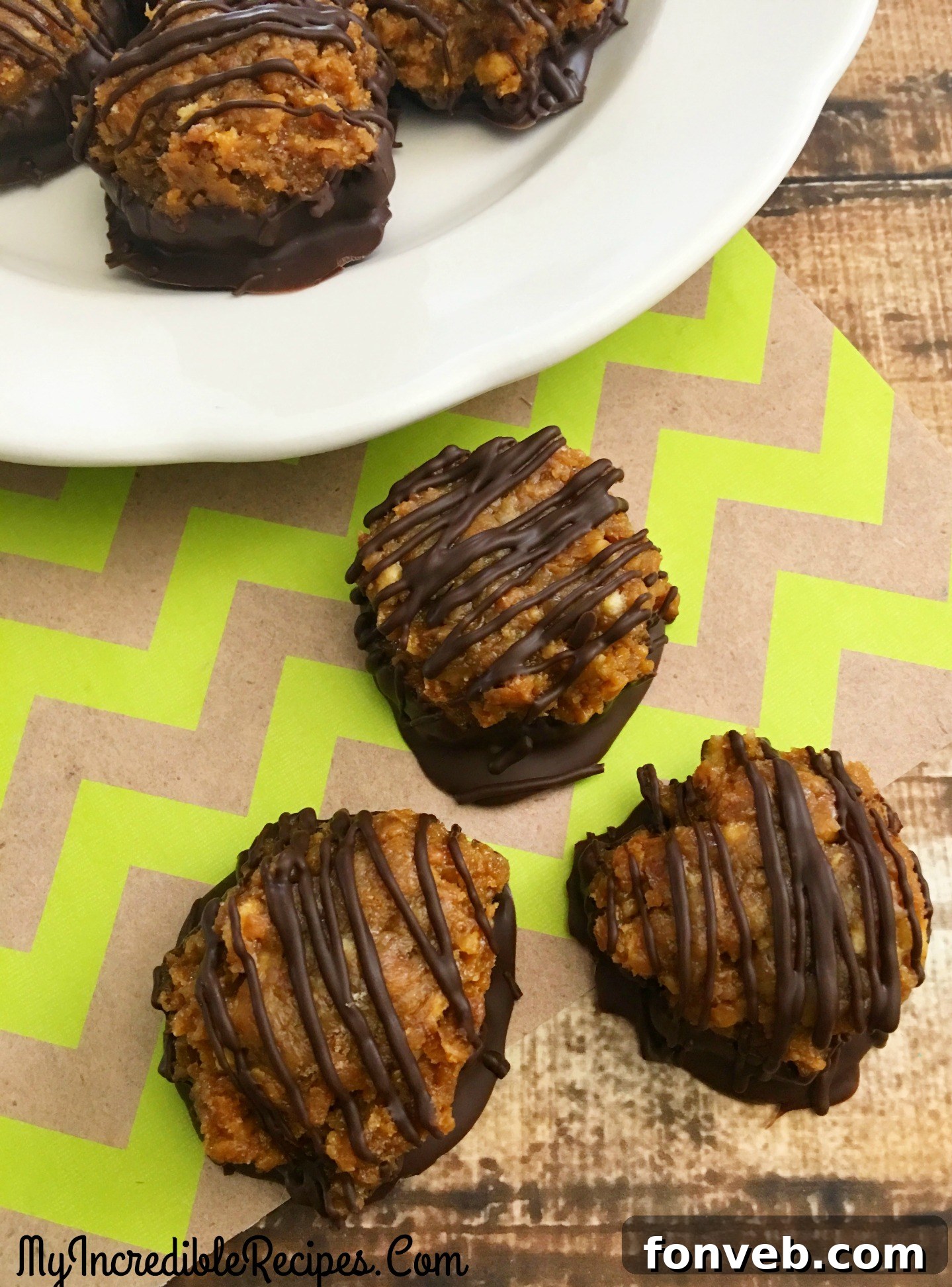 A single Samoa Bite, meticulously crafted, rests on a piece of parchment paper, highlighting its detailed chocolate and caramel finish.