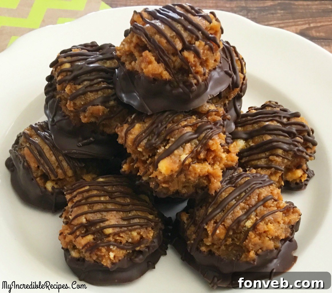 Two Samoa Bites delicately placed on a small white plate, set against a backdrop of a rustic dark wood table. A rich chocolate drizzle adds visual appeal.