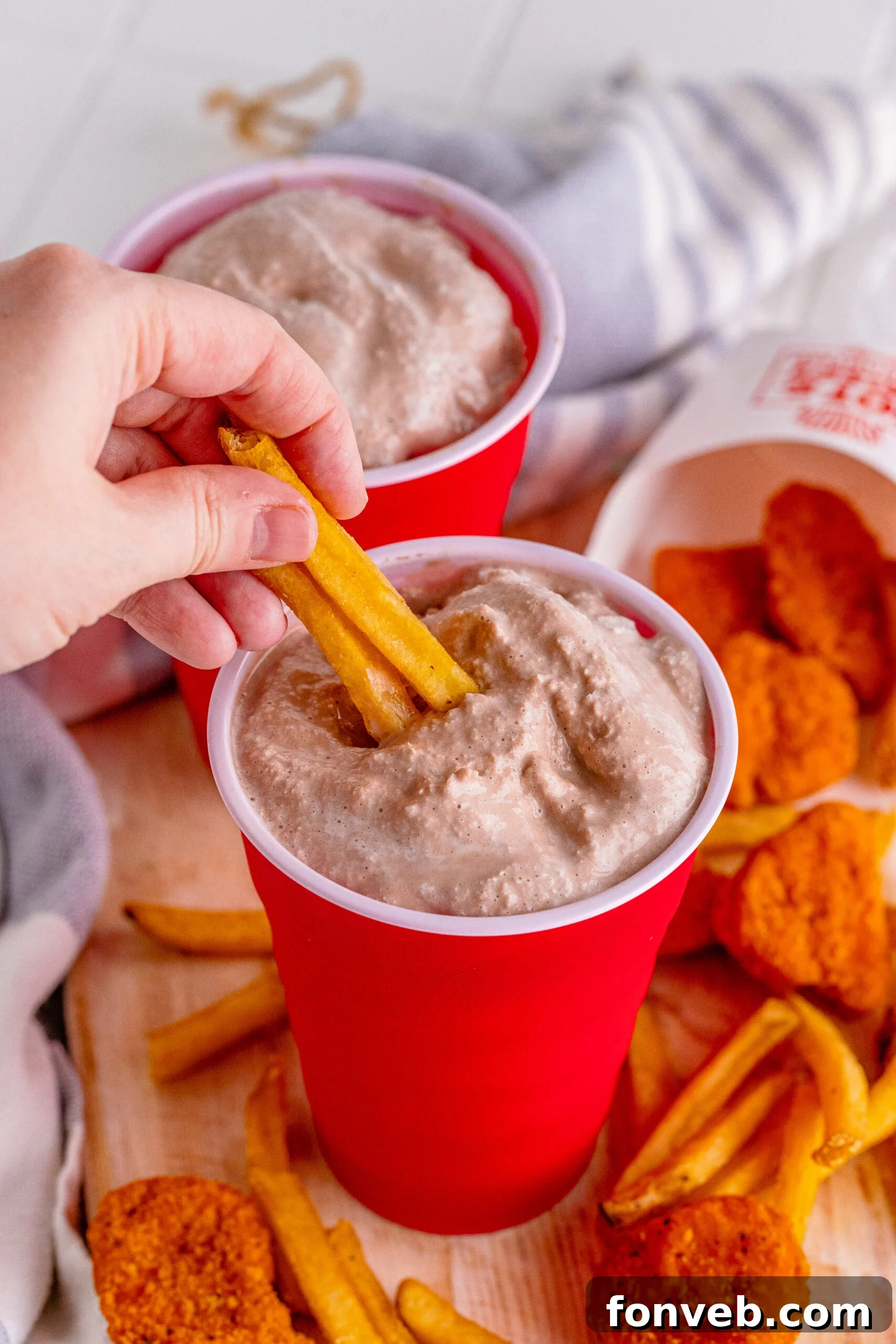 Homemade Wendy's Frosty in a red solo cup with a side of fries, perfect for dipping