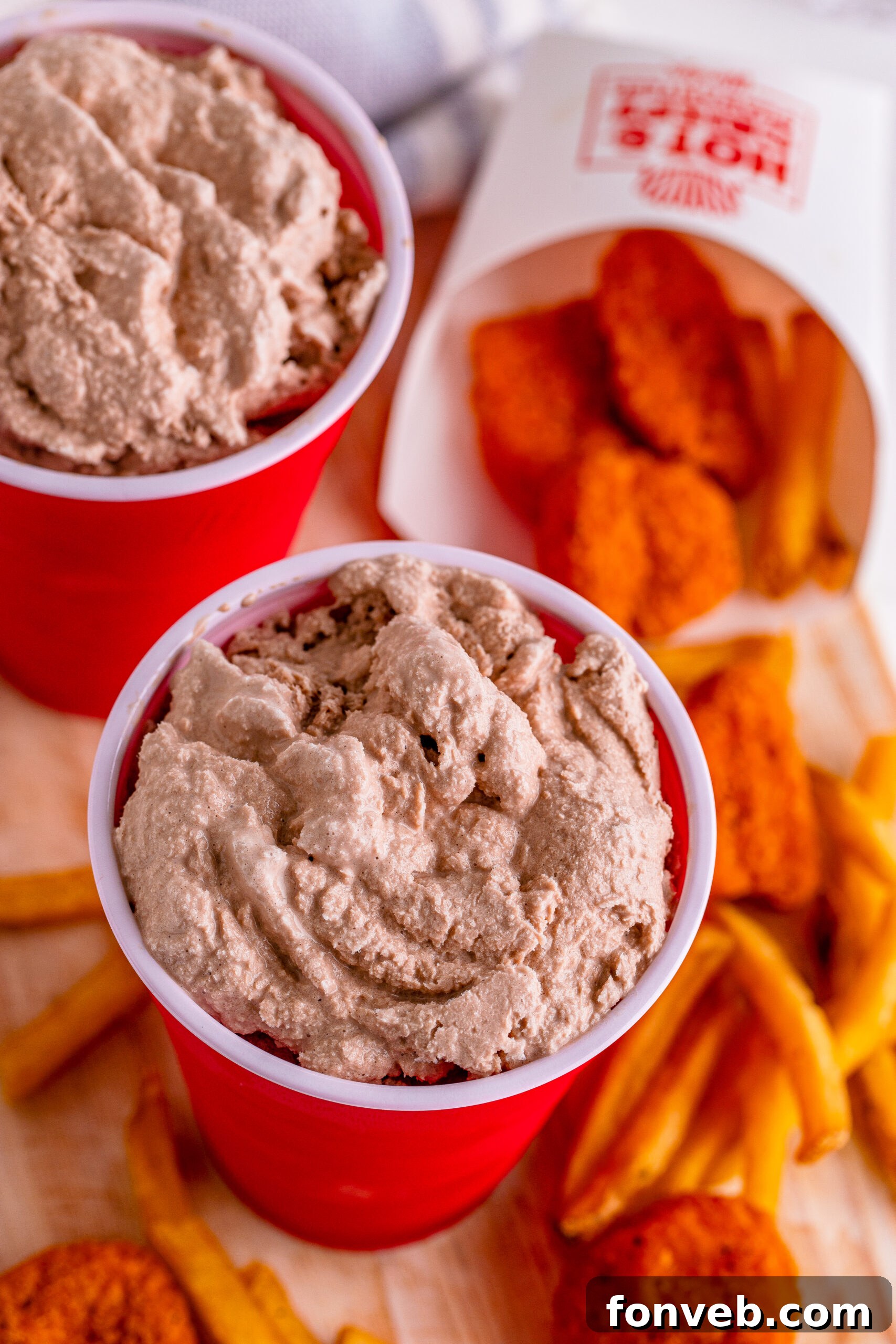 A vibrant homemade Wendy's Frosty served in a classic red solo cup