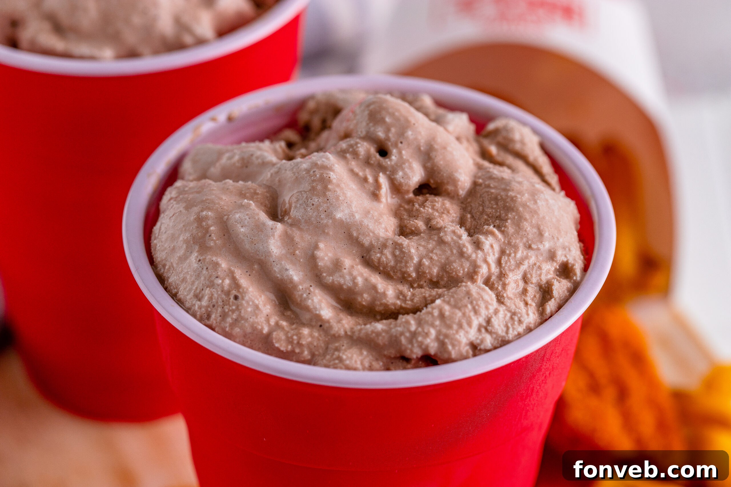 Extremely close-up overhead shot of a homemade Wendy's Frosty in a red solo cup