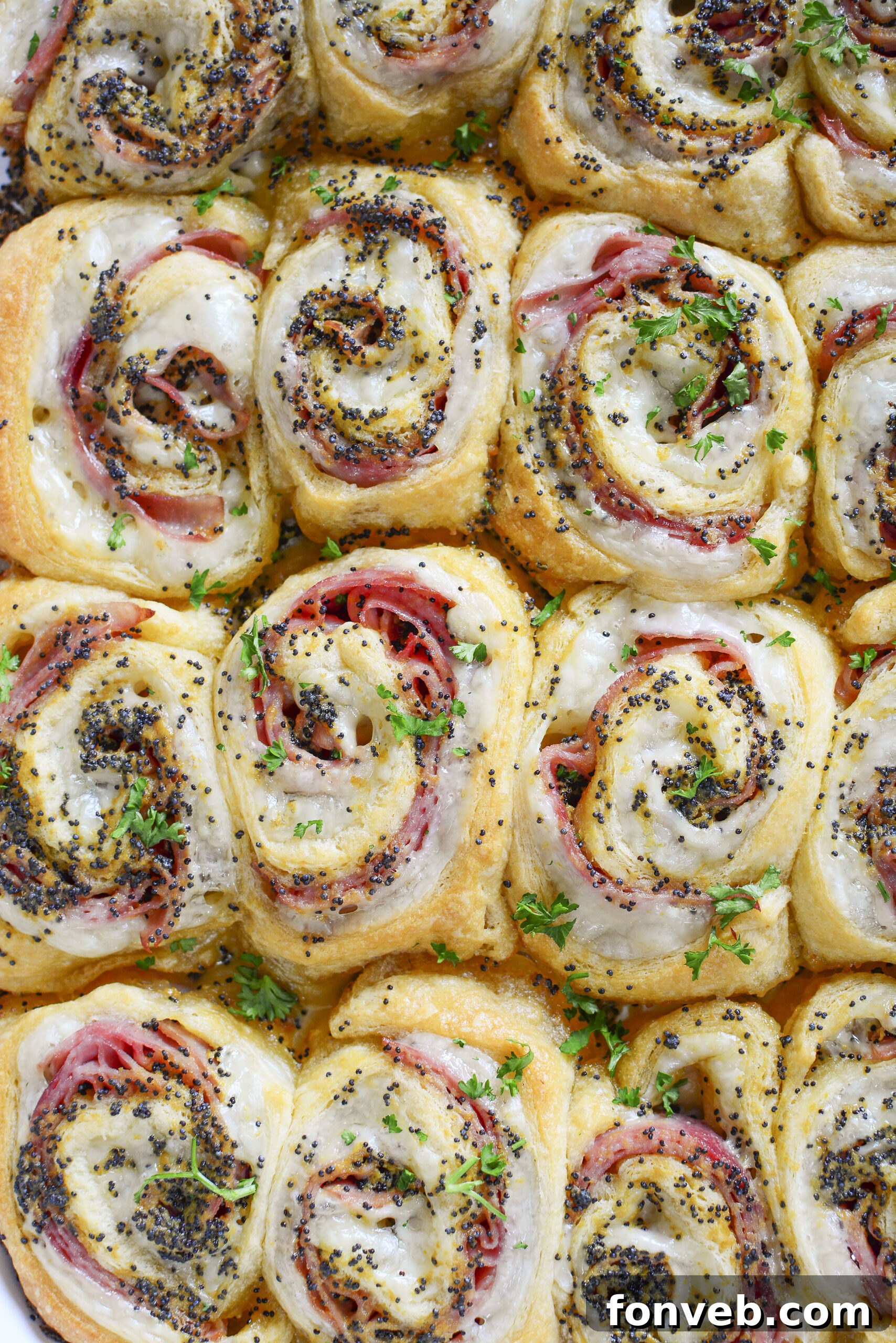 Ham and Cheese Pinwheels in a white baking dish overhead angle