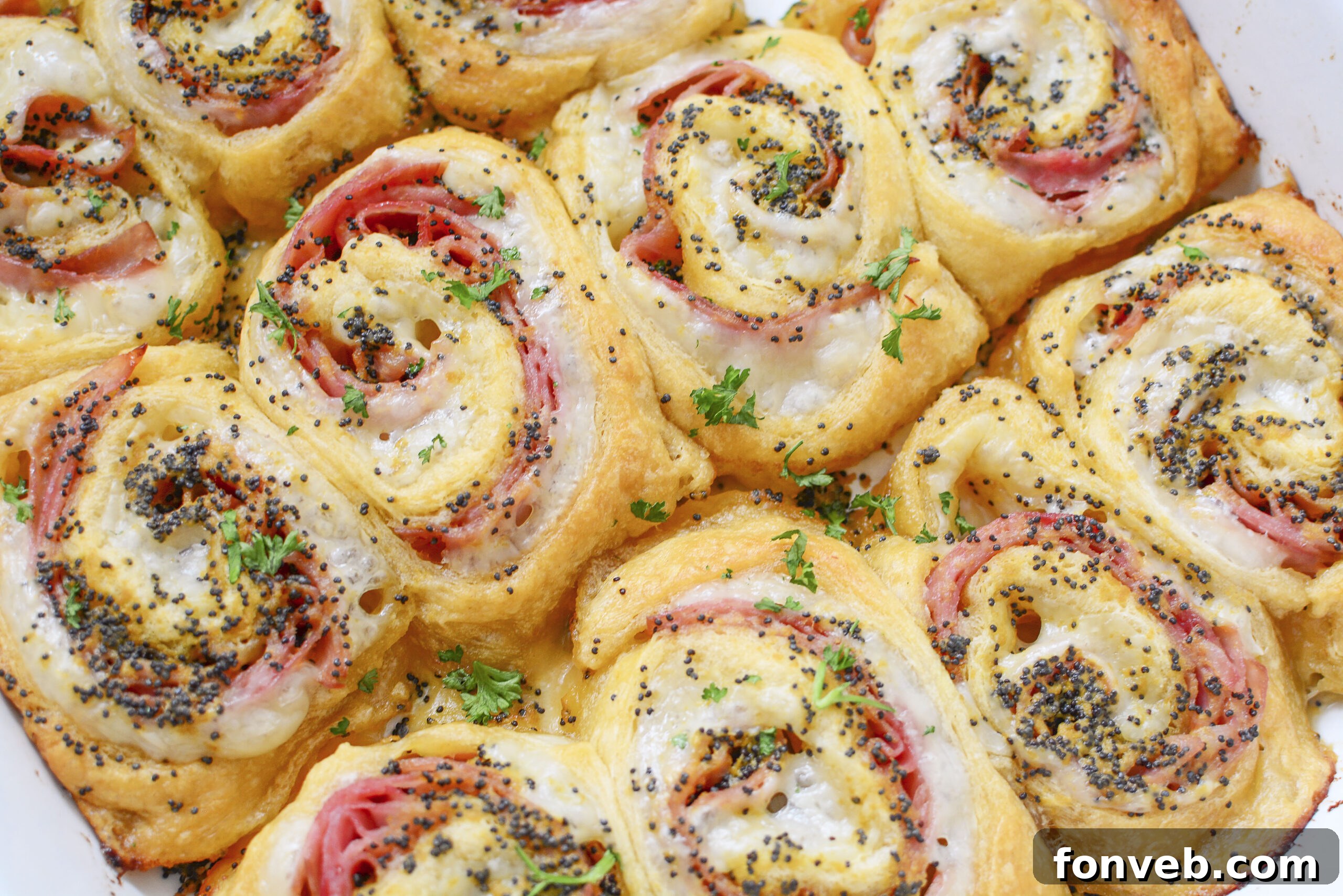 Ham and Cheese Pinwheels in a white baking dish