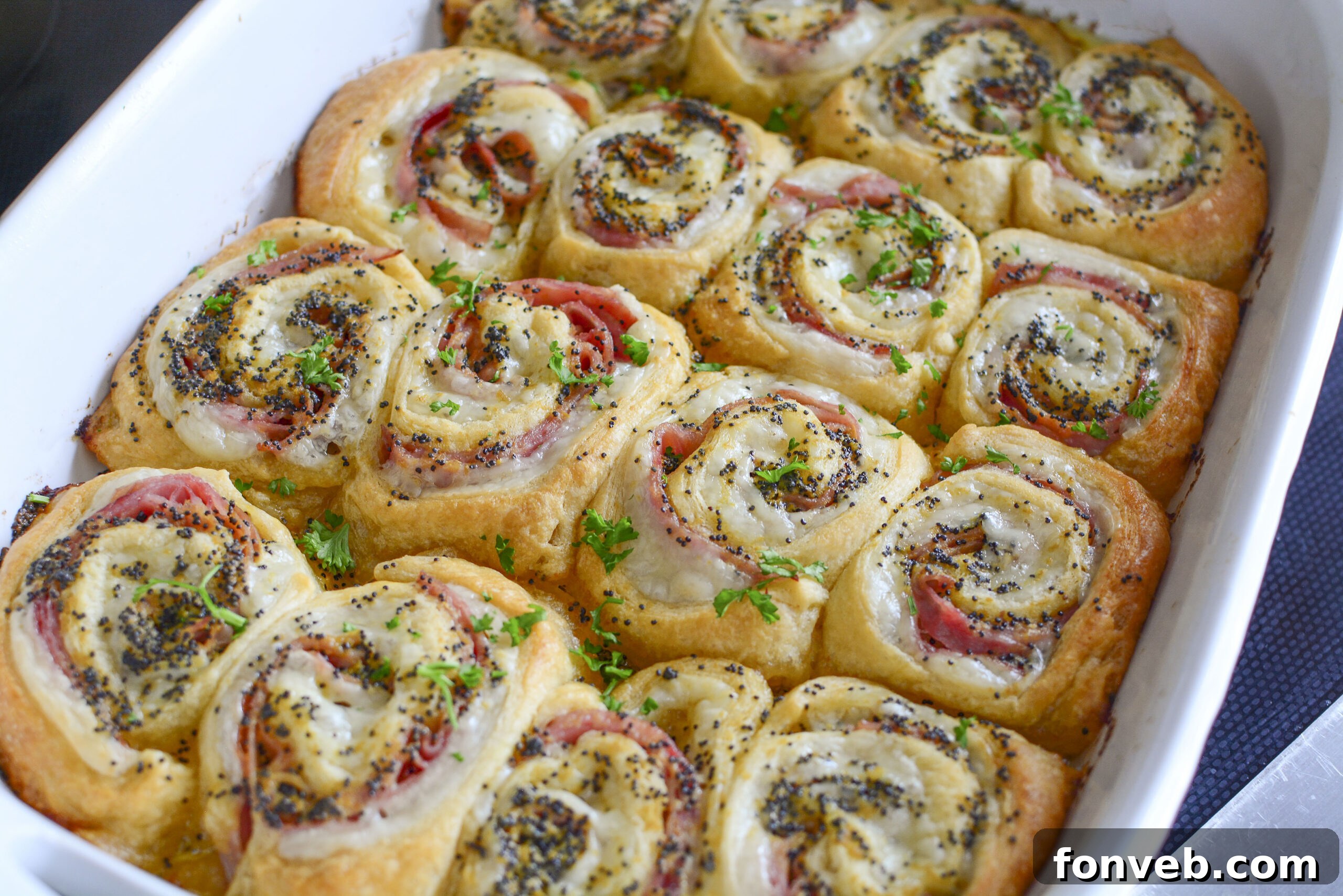Ham and Cheese Pinwheels in a white baking dish