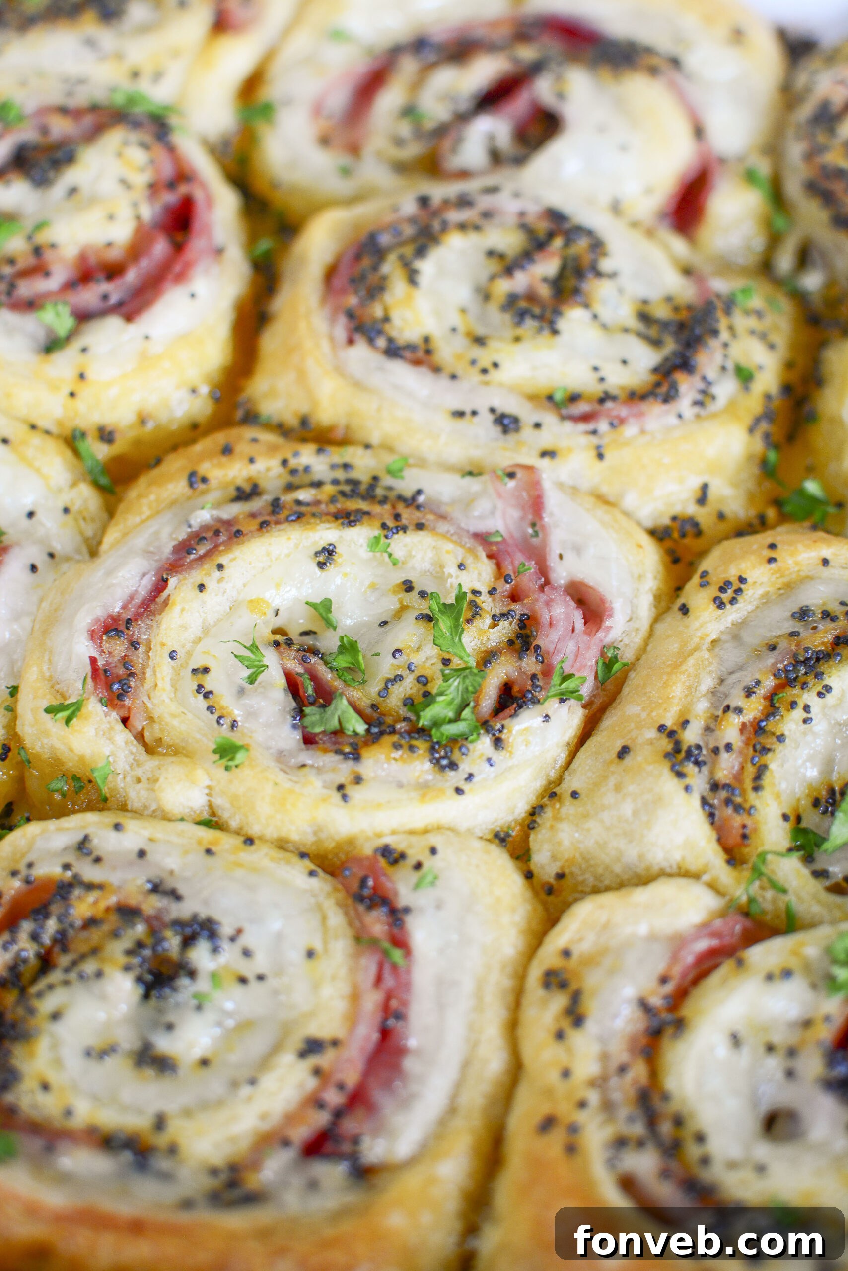 Ham and Cheese Pinwheels in a white baking dish