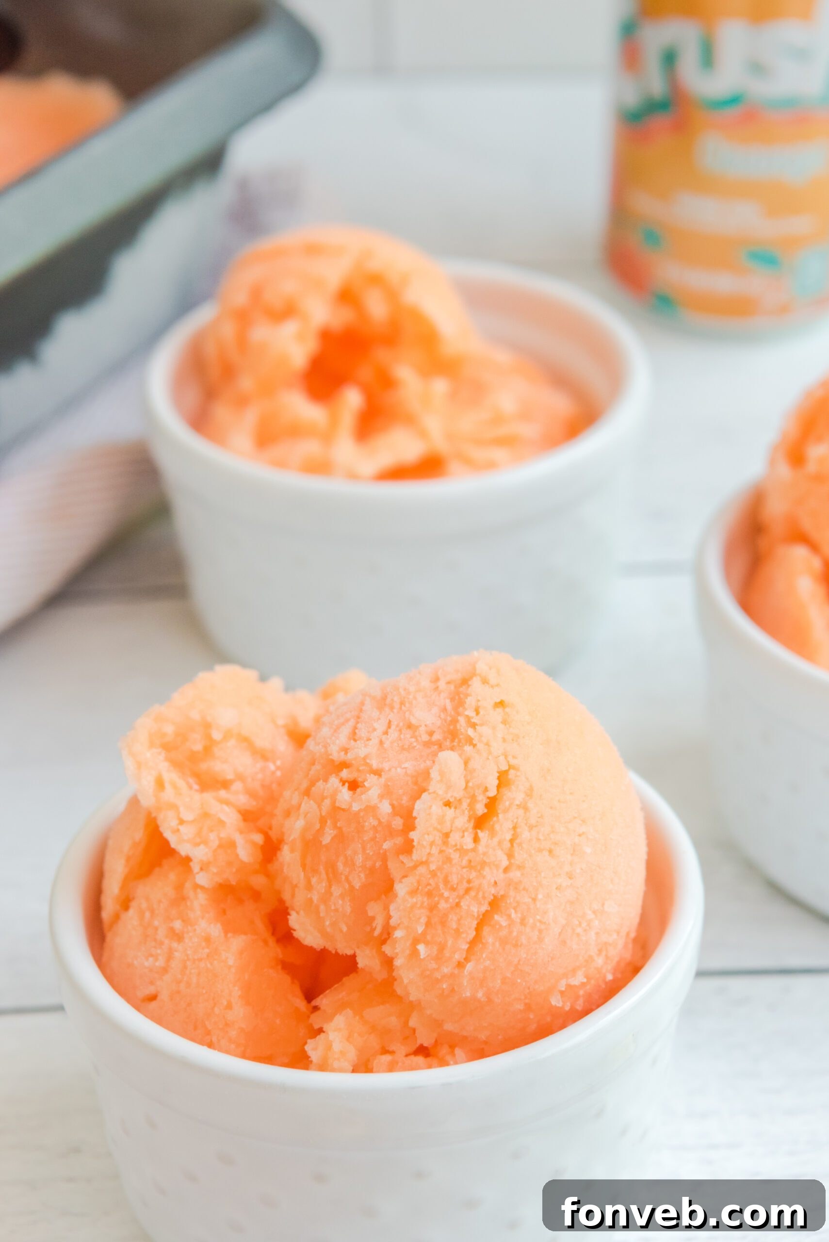 Orange Crush Sherbet beautifully presented in a white bowl, ready to be enjoyed