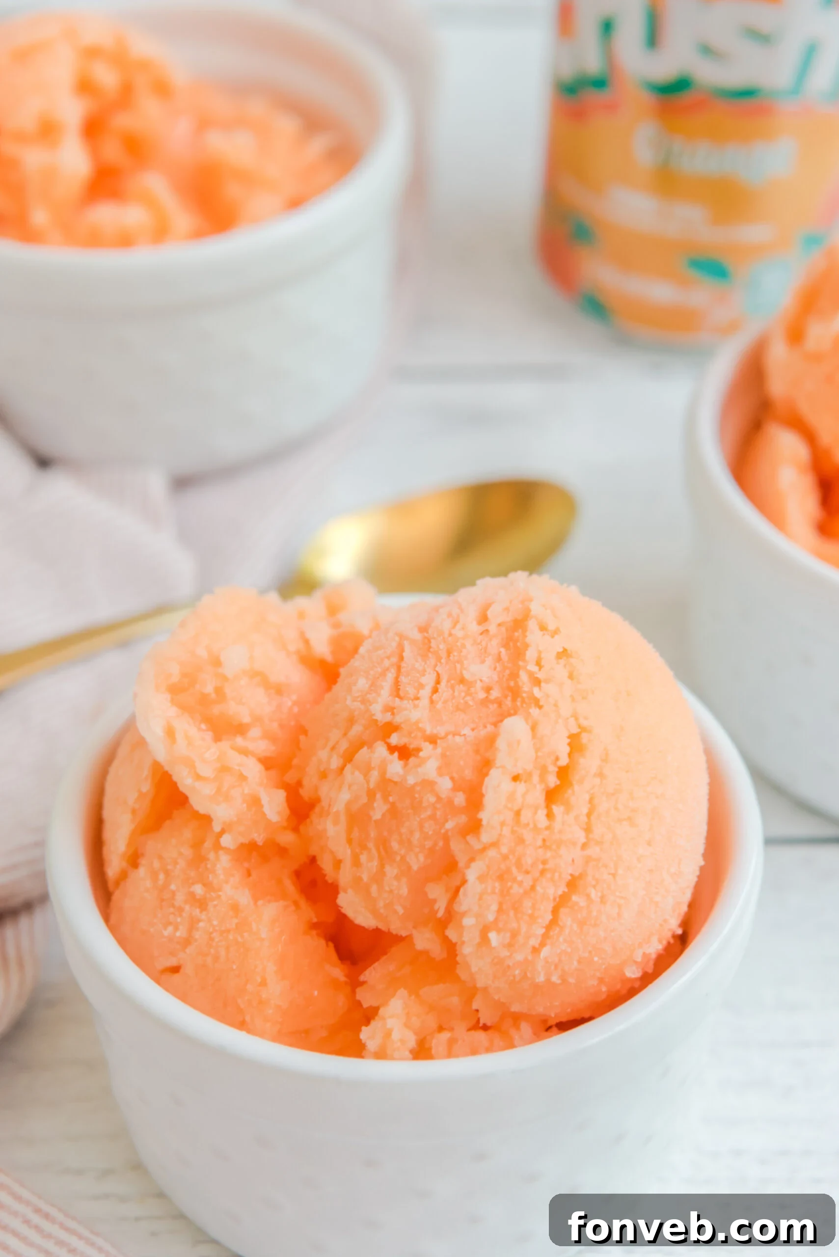 Orange Crush Sherbet showcased in a white bowl, tempting with its vibrant appearance