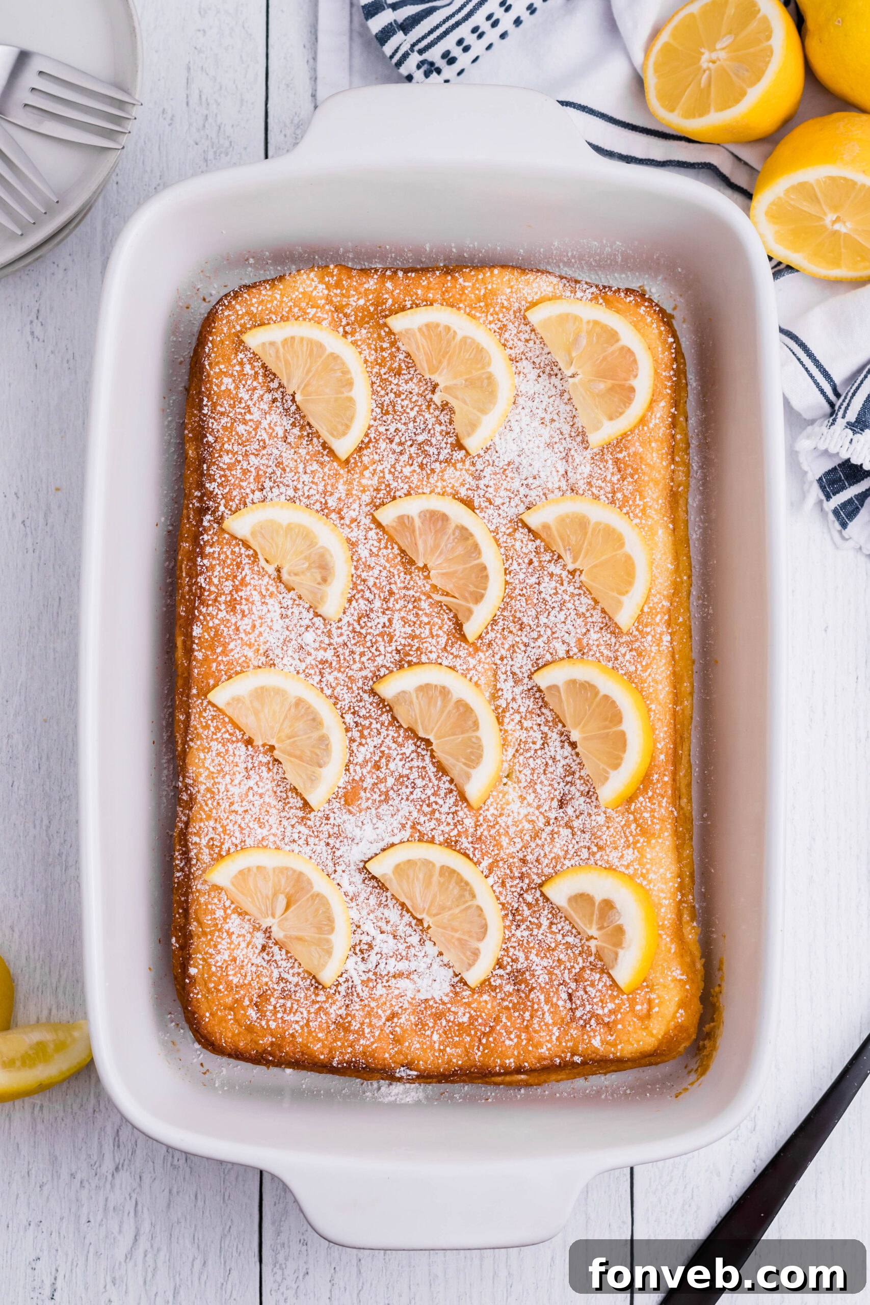 2 Ingredient Lemon Bars uncut in a white baking pan overhead shot