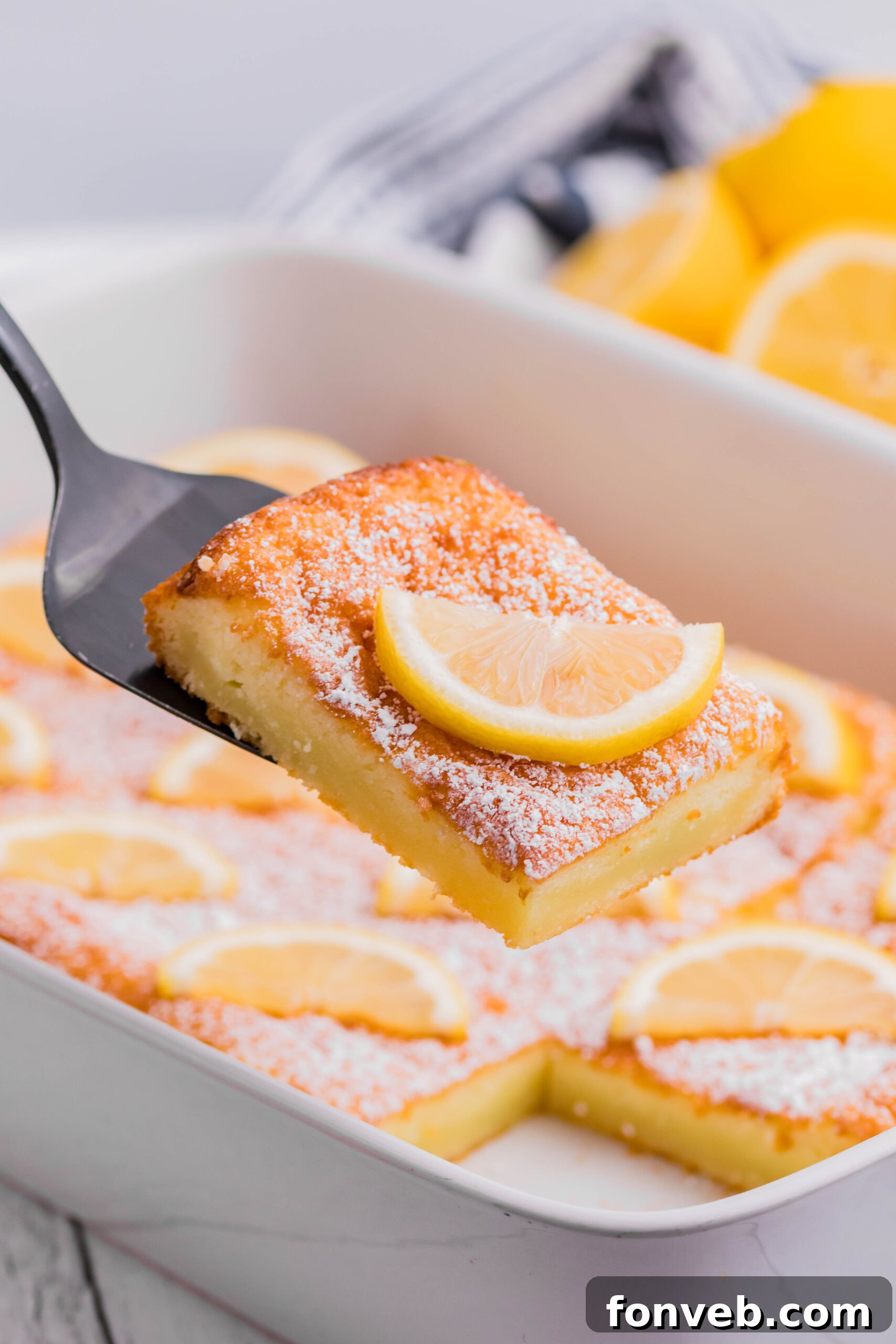 2 Ingredient Lemon Bars slice being lifted up on a spatula