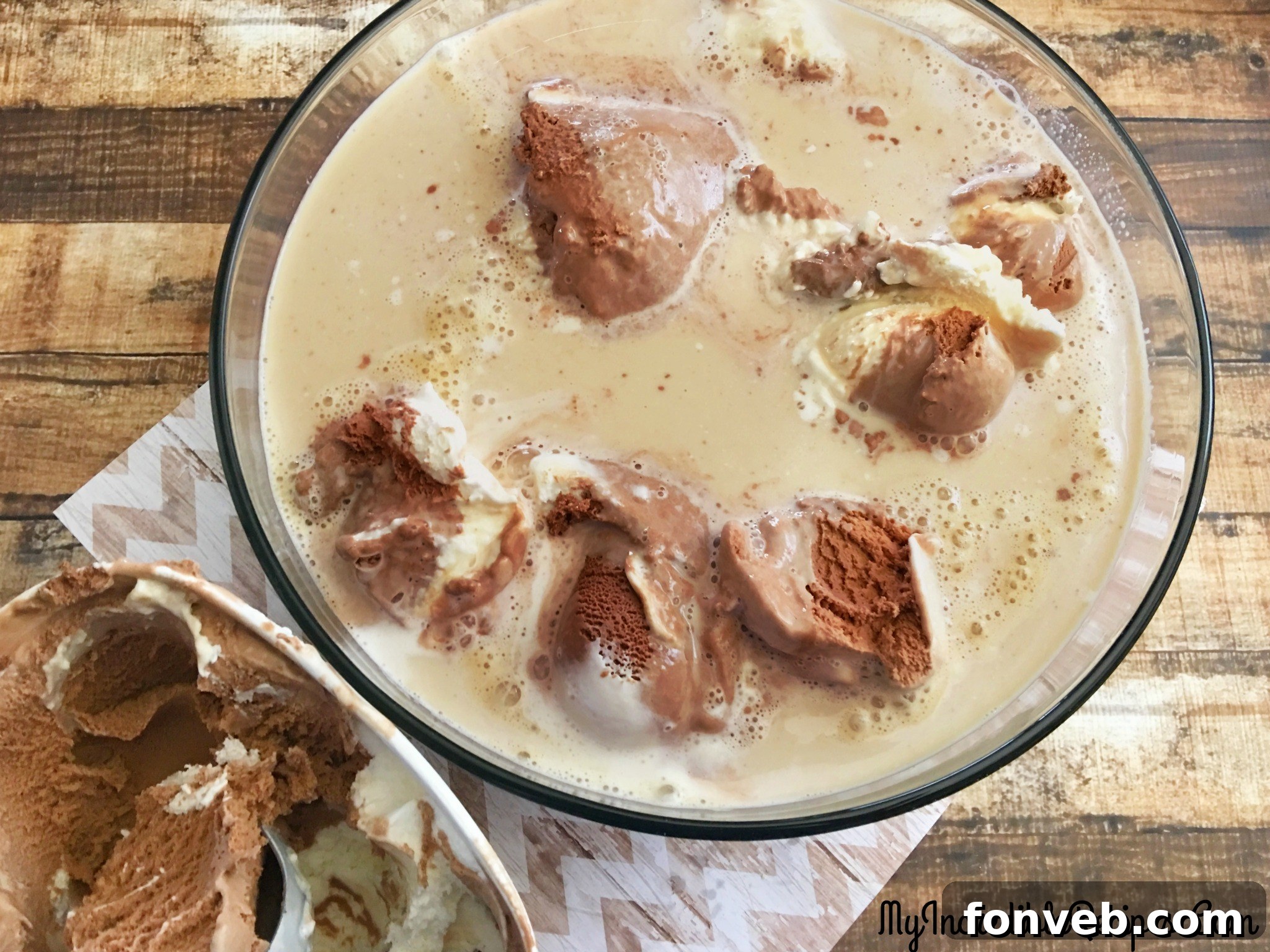 A glass of coffee punch garnished with a whole coffee bean