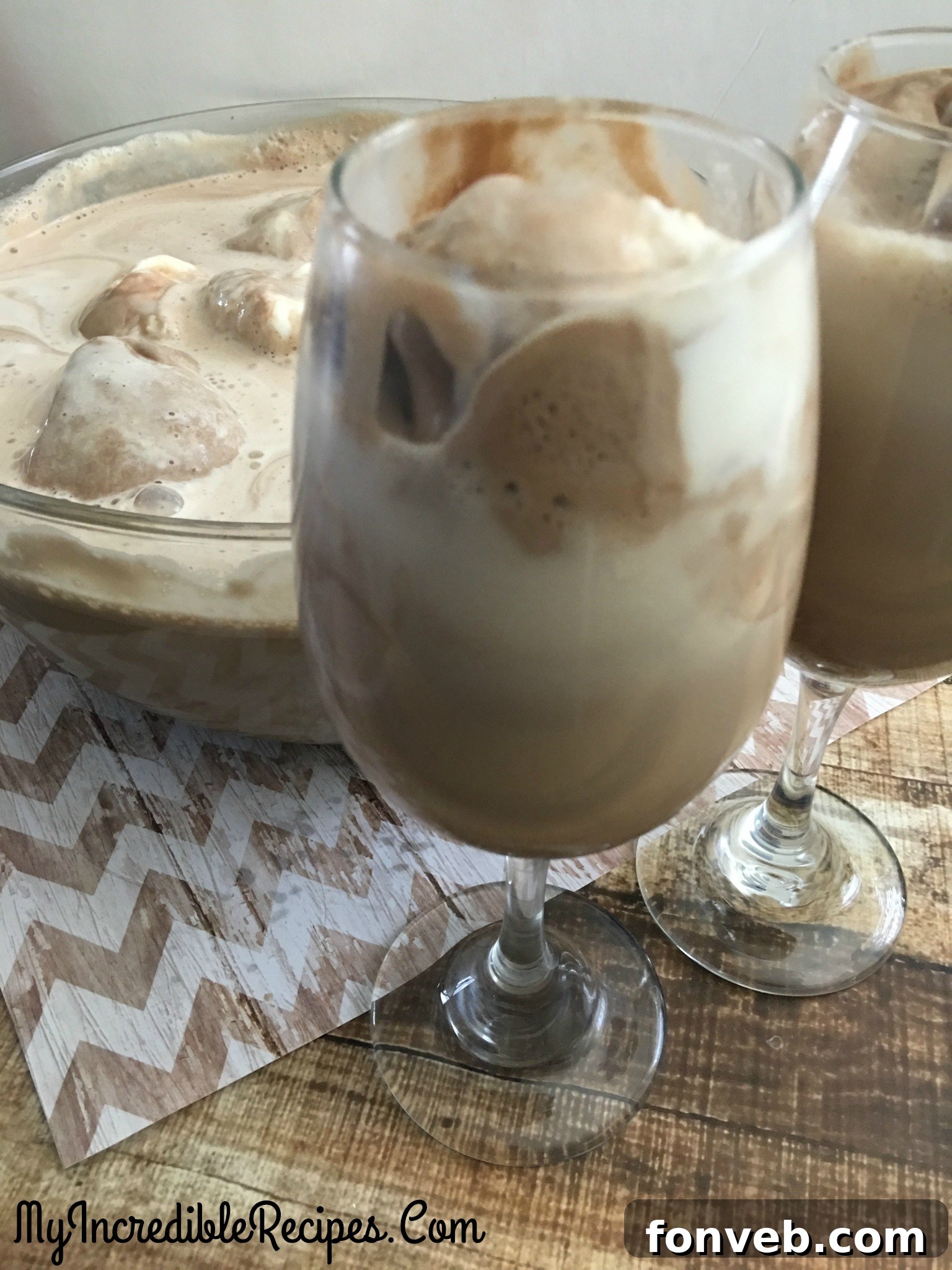 A single glass of coffee punch with whipped cream and sprinkles