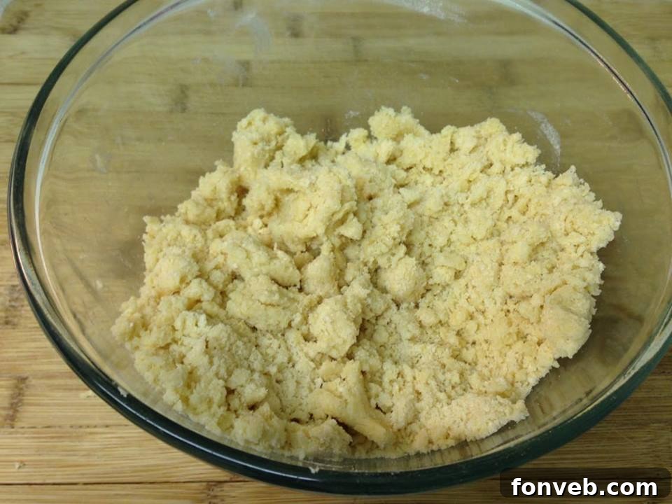 Jammy Raspberry Oat Bars 4 A perfectly cut square of raspberry crumble bar on a white plate, showcasing the distinct layers of crust, filling, and crumble.