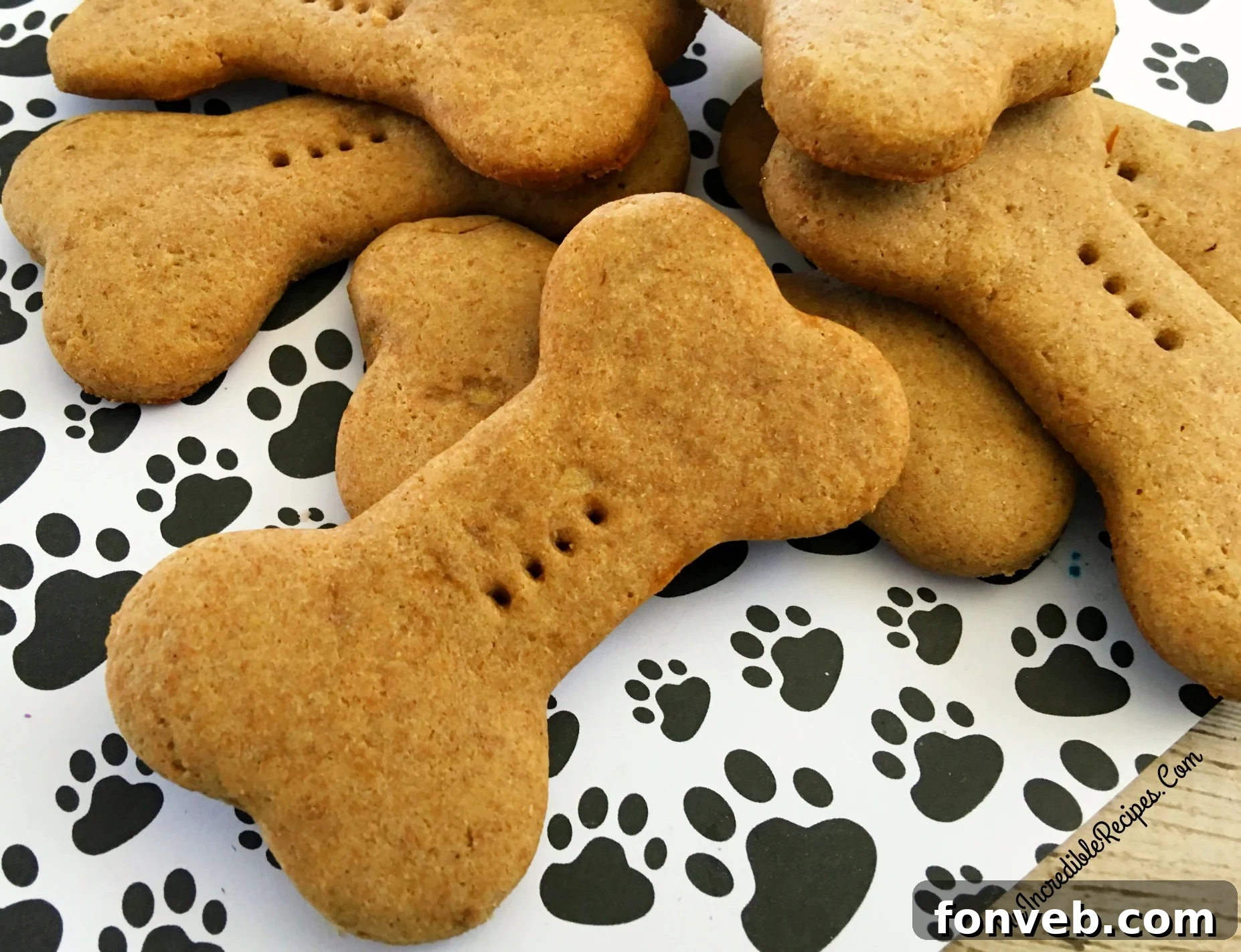Happy dog enjoying homemade biscuit