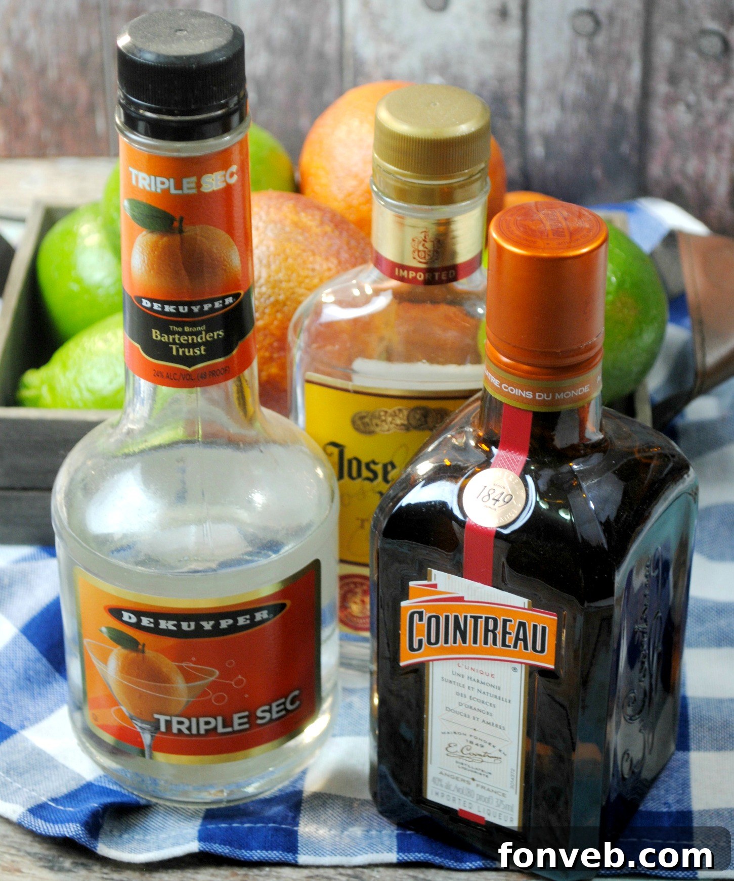 A close-up shot of a freshly cut blood orange revealing its rich, ruby red interior, placed beside a glass, highlighting the fruit's unique beauty.