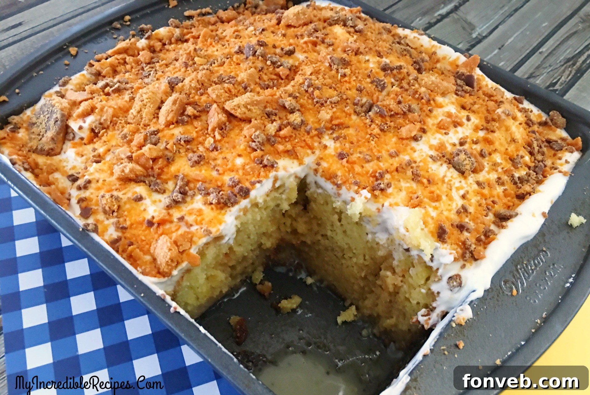 A close-up view of the crushed Butterfinger candy topping, adding texture and iconic flavor to the cake.