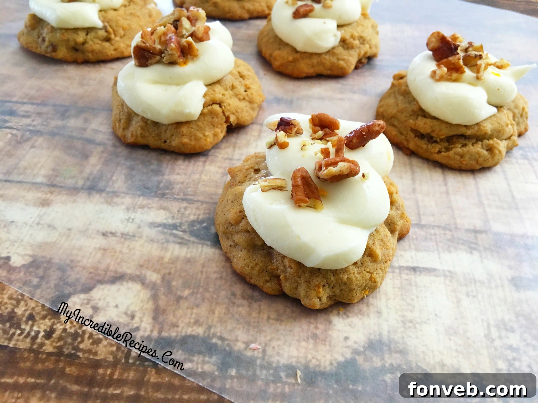 A tray of carrot cake cookies, some frosted, some unfrosted