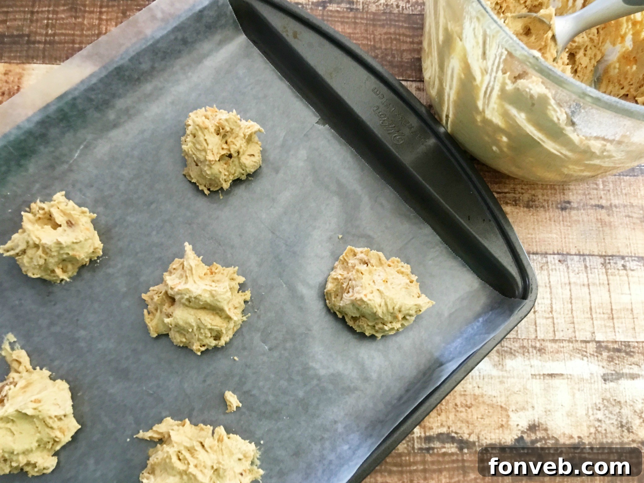 Stack of moist carrot cake cookies with a hint of frosting