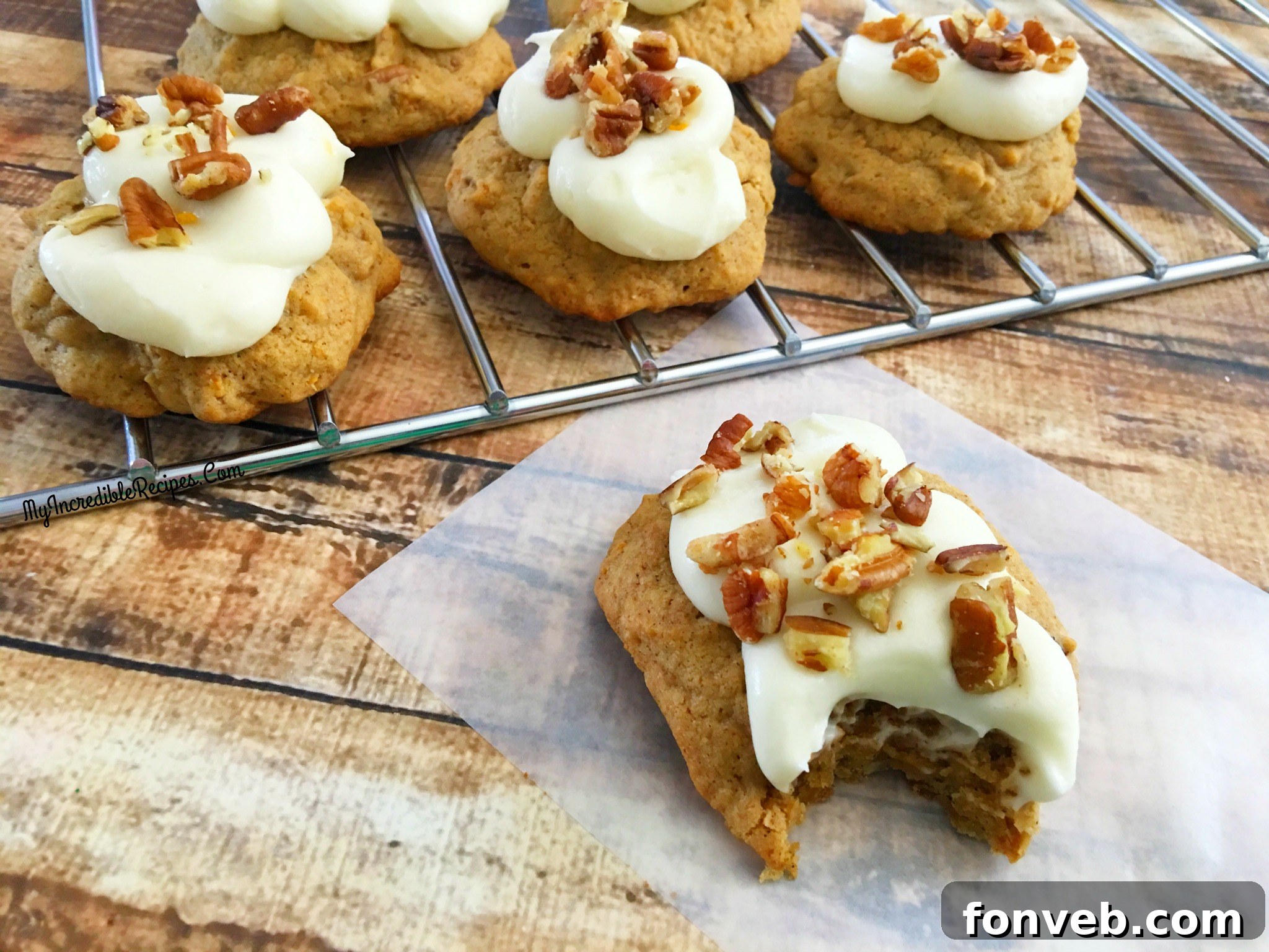 Close-up of a carrot cake cookie with creamy orange frosting