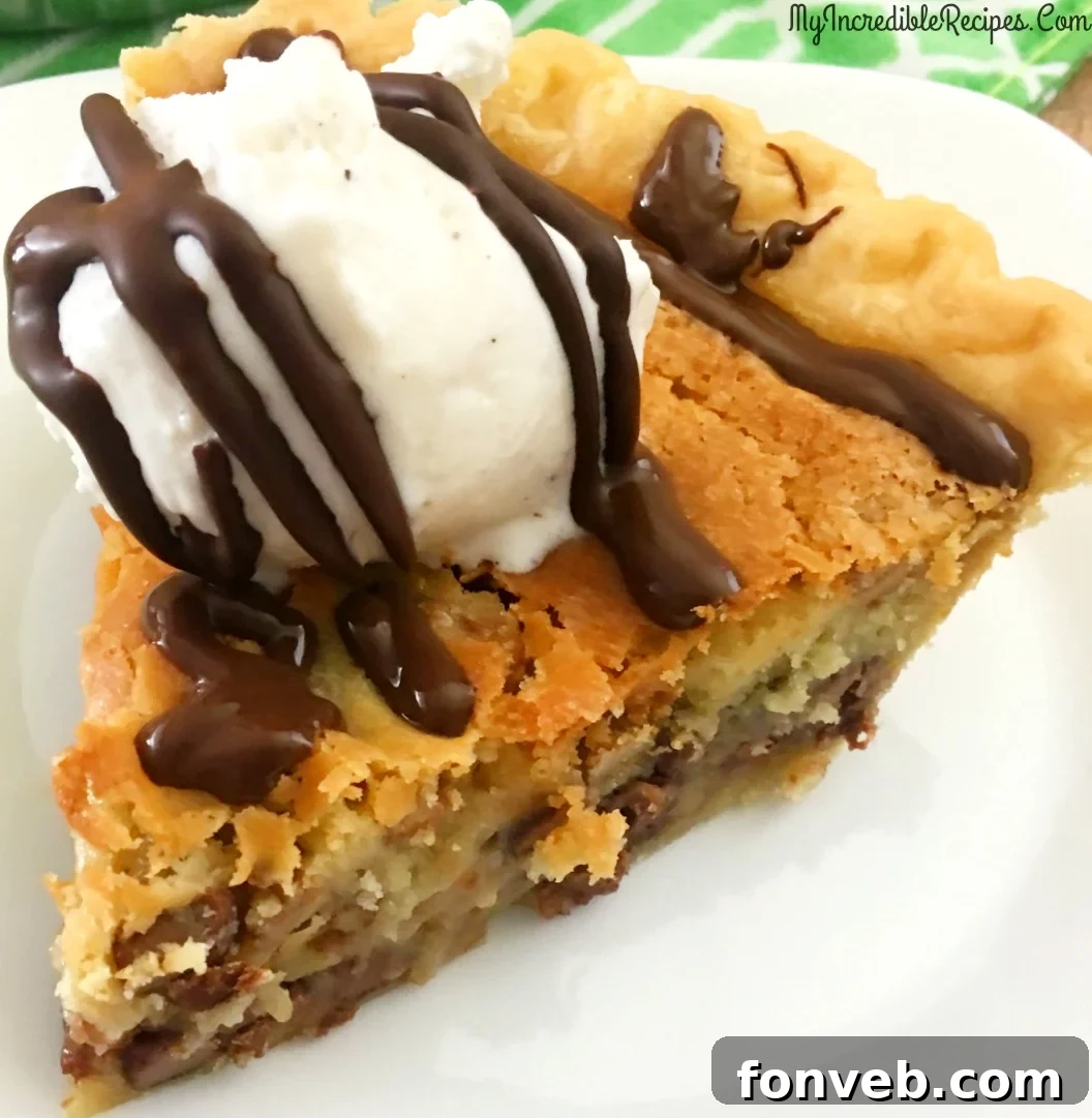 Deliciously warm chocolate chip pie with a golden, flaky crust