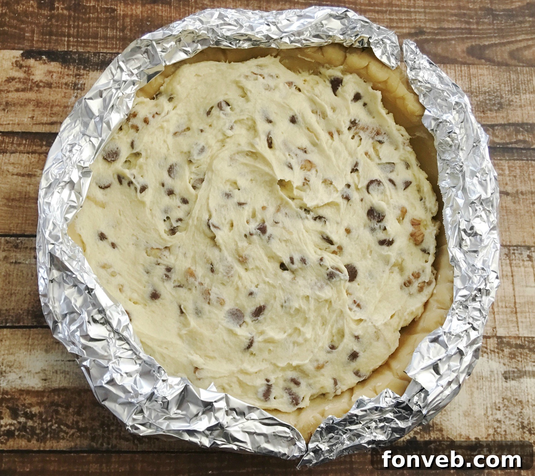 Close-up of chocolate chips and walnuts in pie filling batter