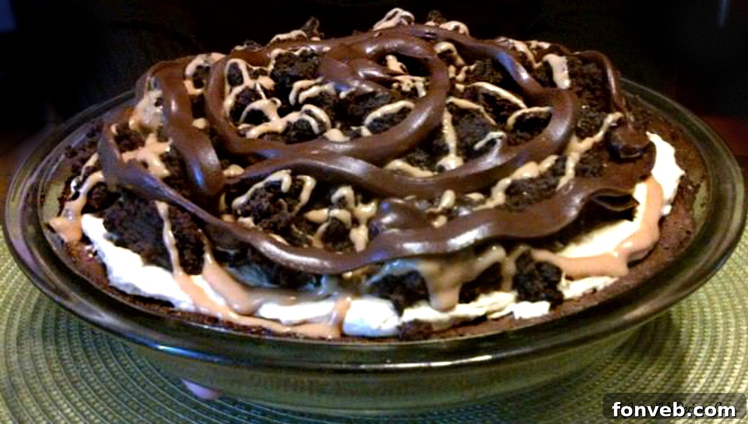 Delicious Peanut Butter Brownie Pie slice with chocolate and nuts