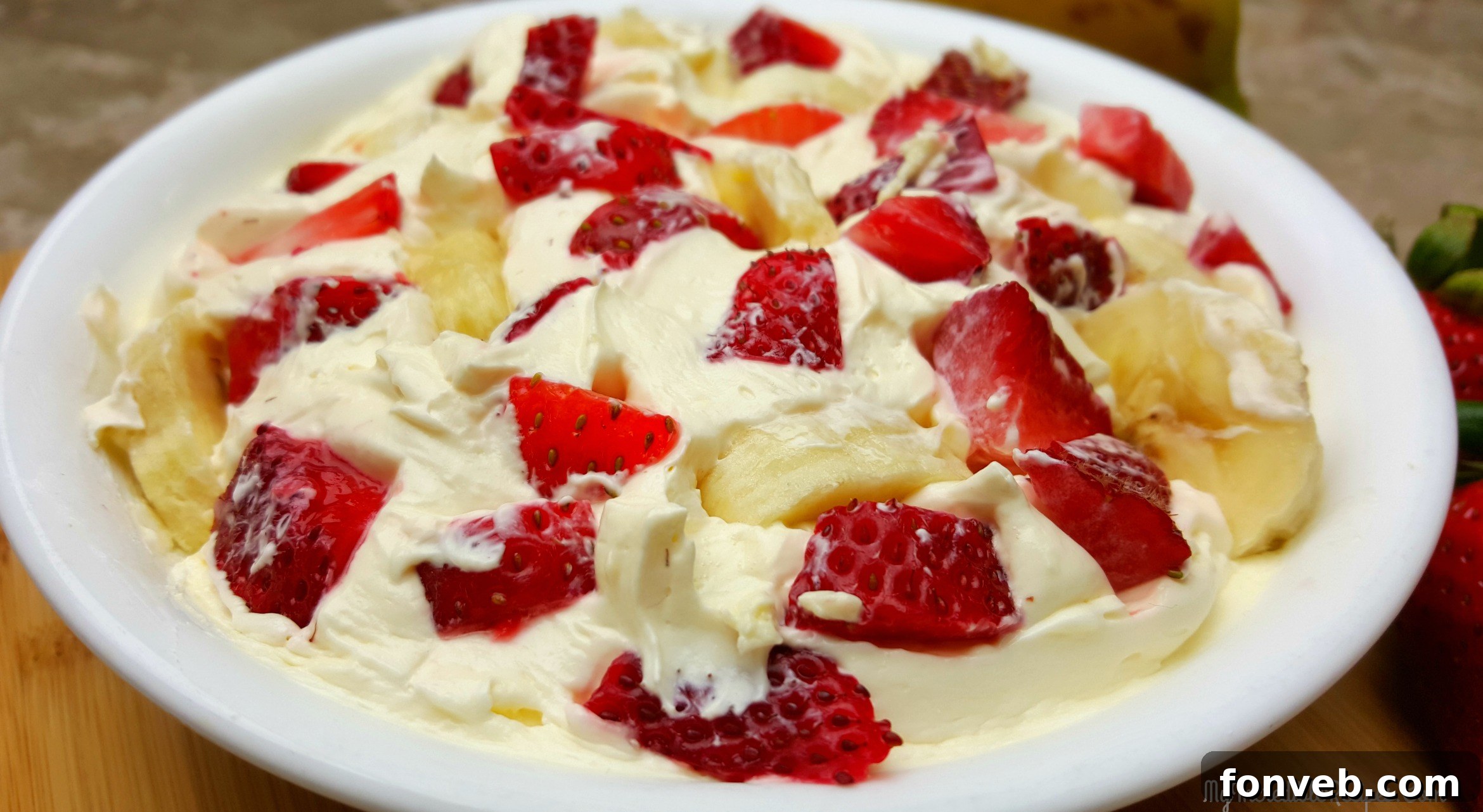 Strawberry Banana Cheesecake Delight 2 A refreshing bowl of Strawberry Banana Cheesecake Salad, ready to serve and impress.