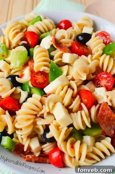 A portion of the Italian Pizza Pasta Salad on a white plate, ready to be enjoyed