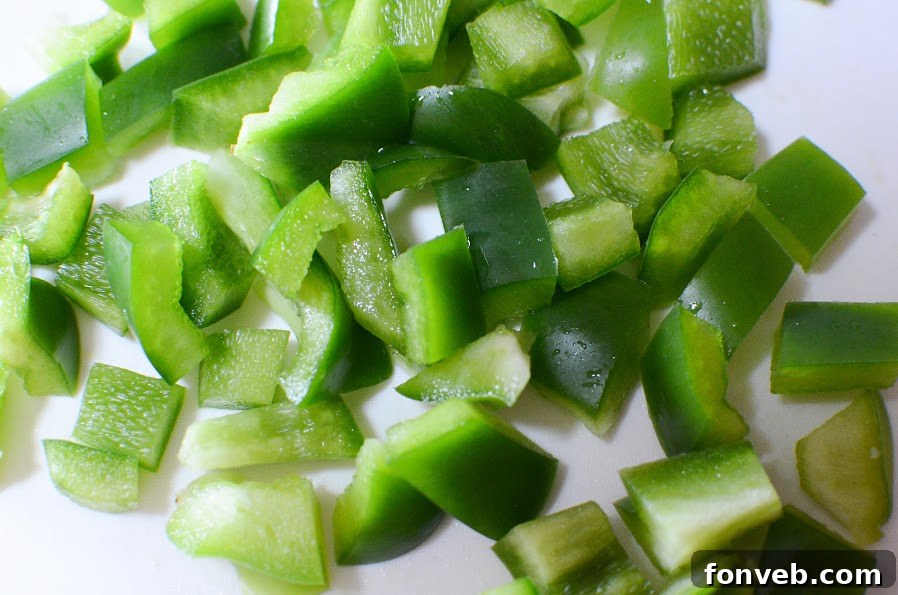 Close-up shot of a colorful Italian Pizza Pasta Salad, showcasing the diverse ingredients like rotini pasta, pepperoni, tomatoes, and olives