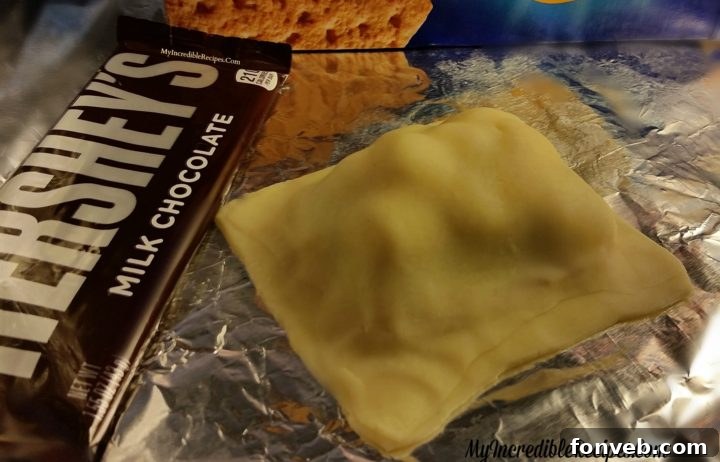 Second pie crust placed over s'mores filling before sealing