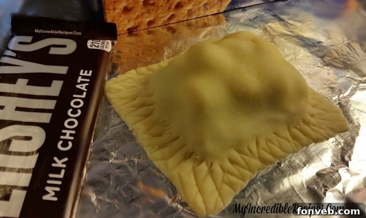 Sealed s'mores pocket pie with decorative fork crimps