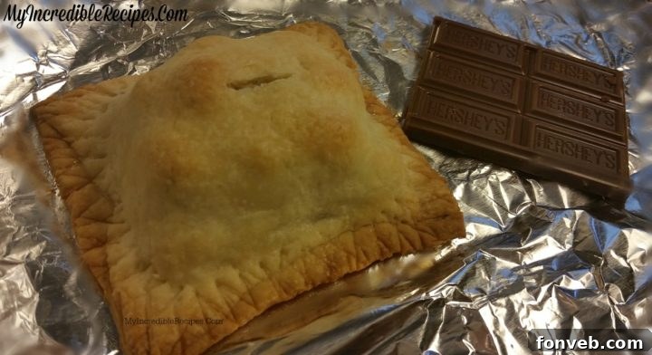 Baked Hershey's s'mores pocket pies cooling on a rack