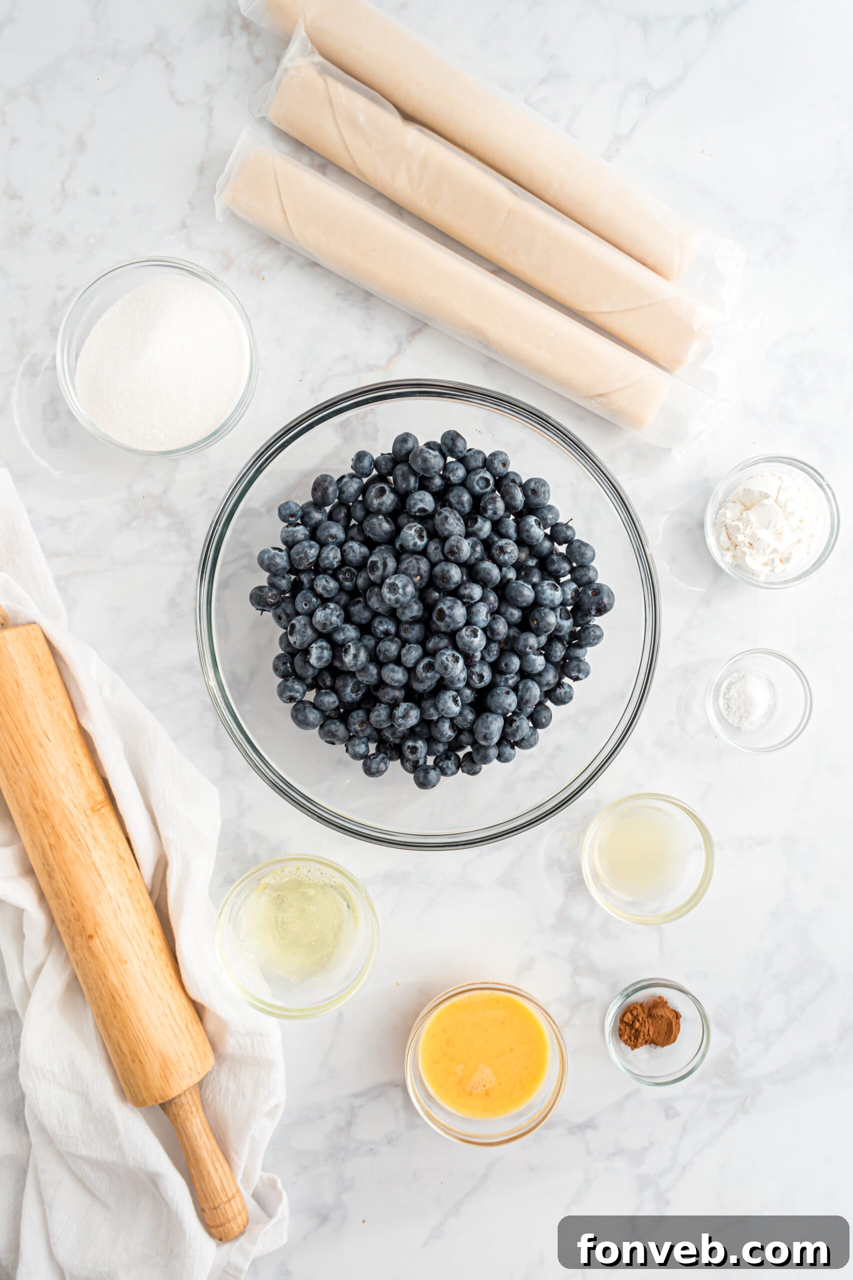 All the fresh ingredients meticulously laid out for the delectable Blueberry Slab Pie.