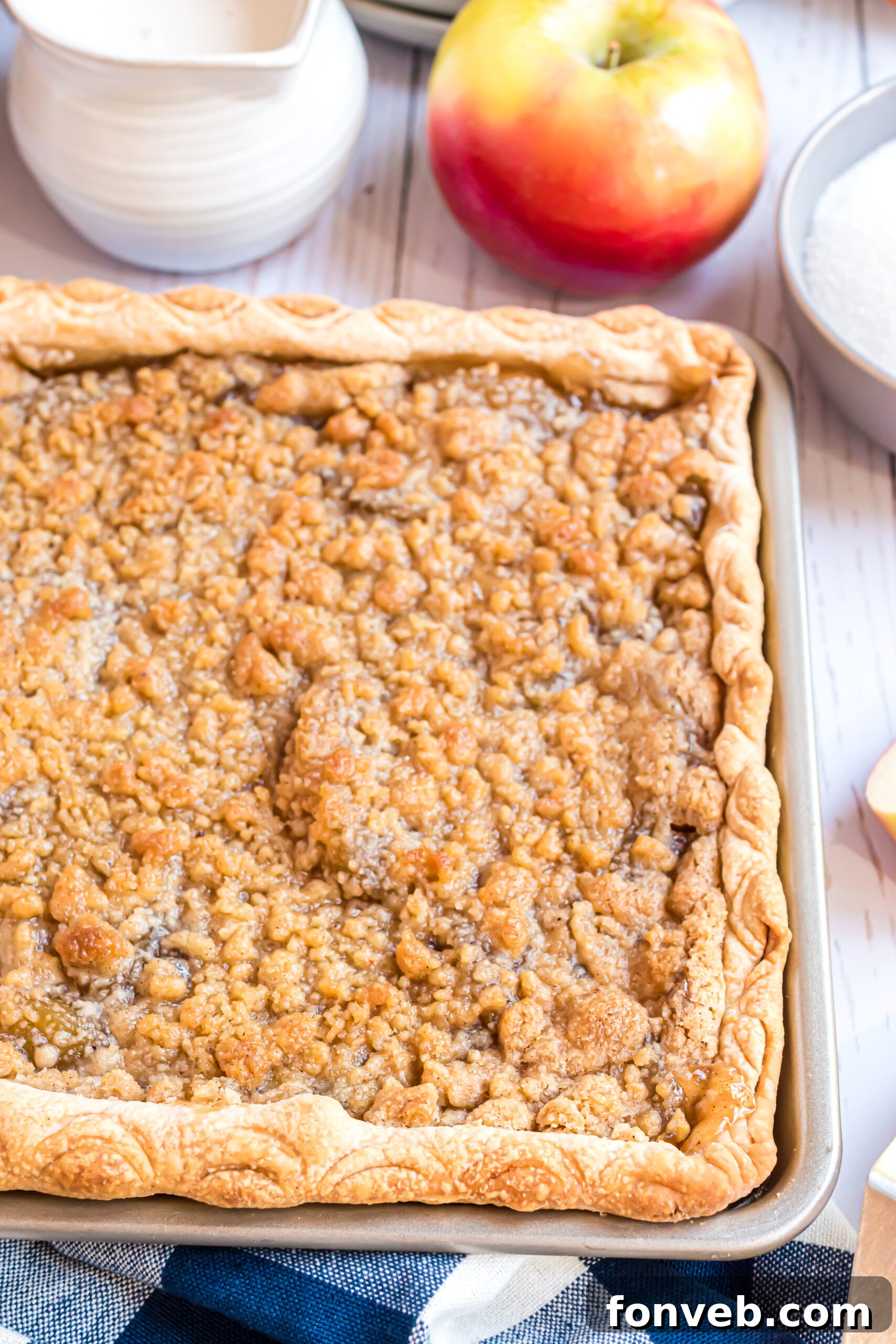 Apple slab pie uncut in a baking sheet 