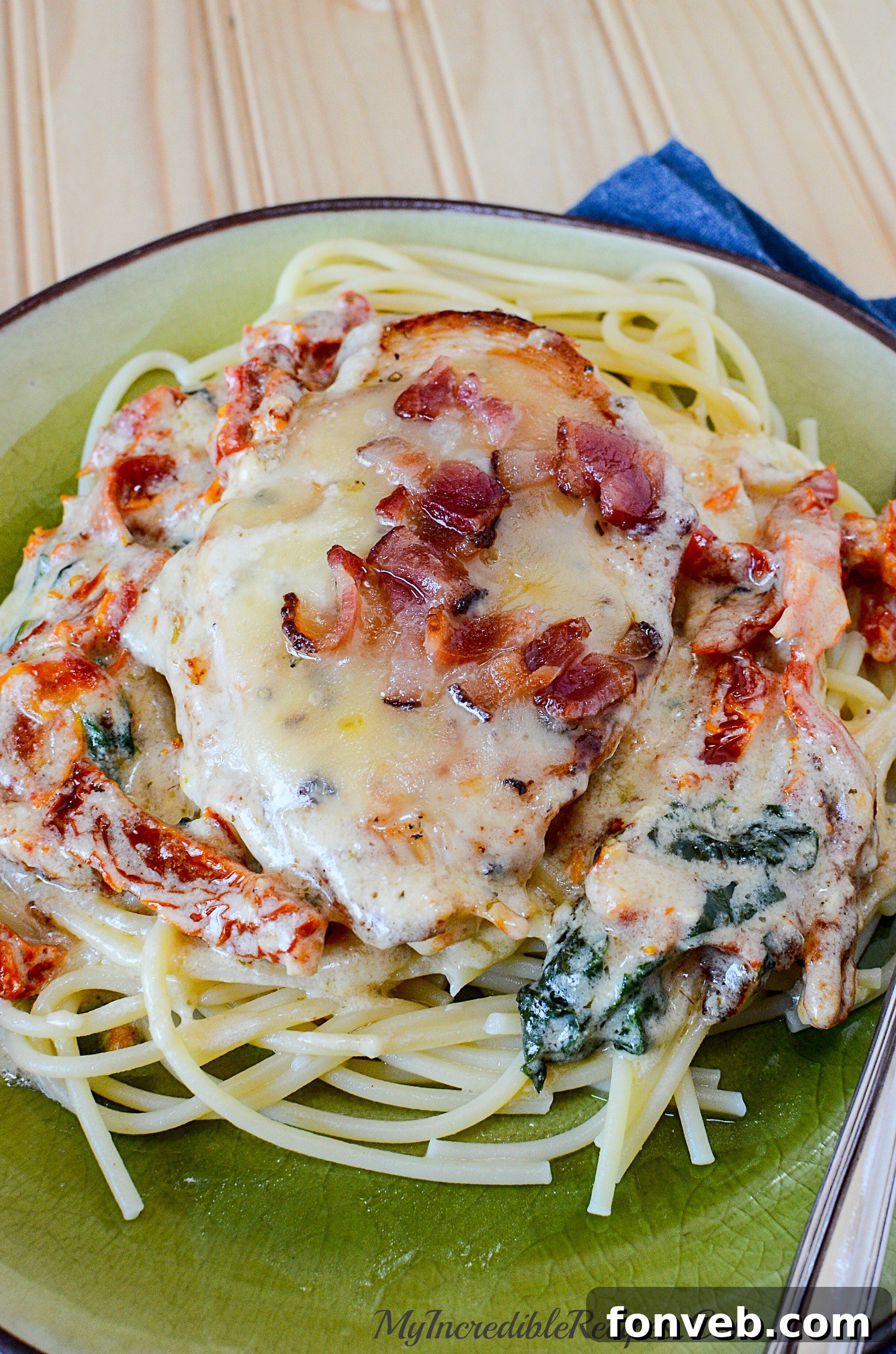 Spaghetti tossed with the creamy garlic chicken, sauce, and toppings