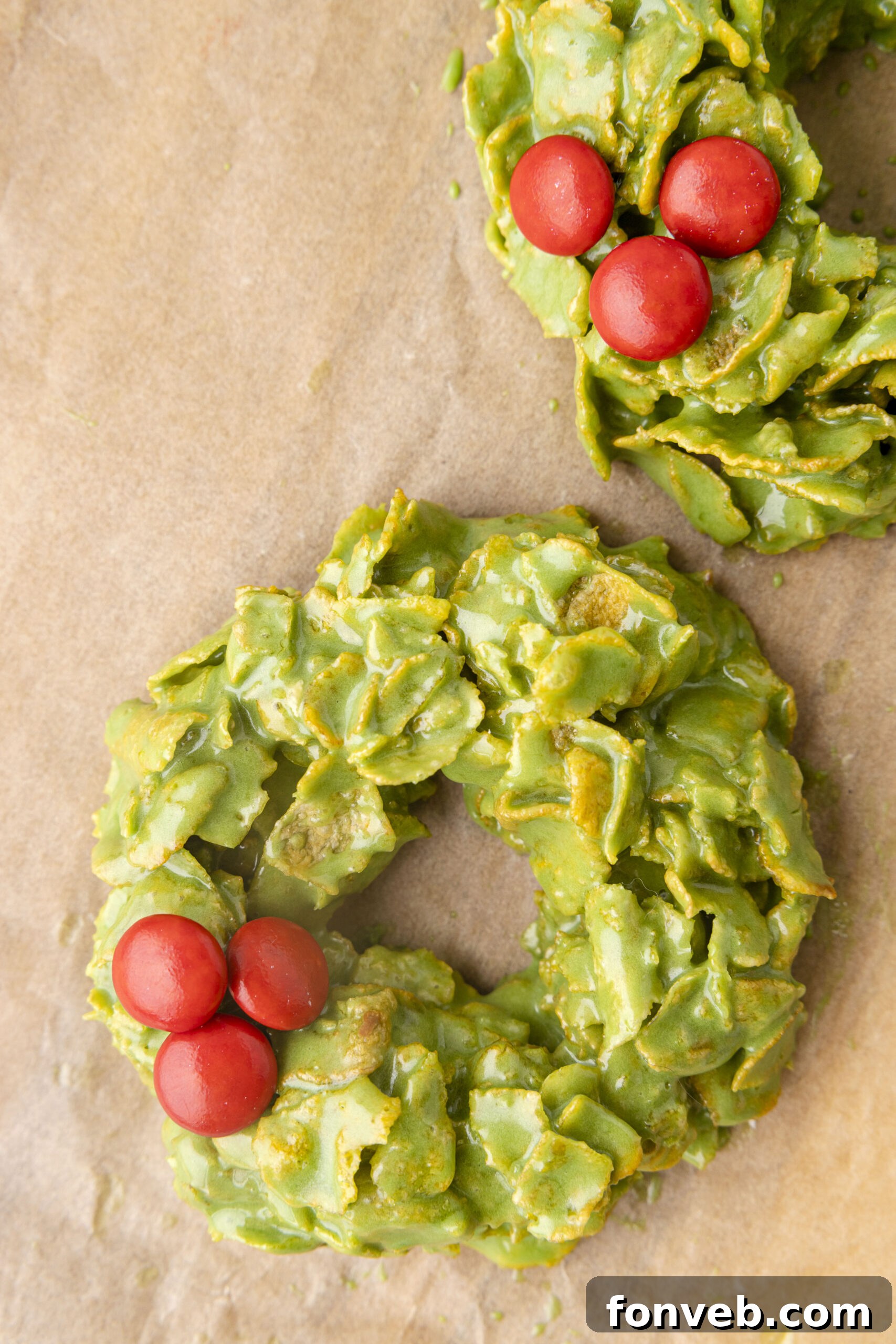 Overhead view of a spread of vibrant no-bake Christmas wreaths, beautifully decorated and ready for the holidays.