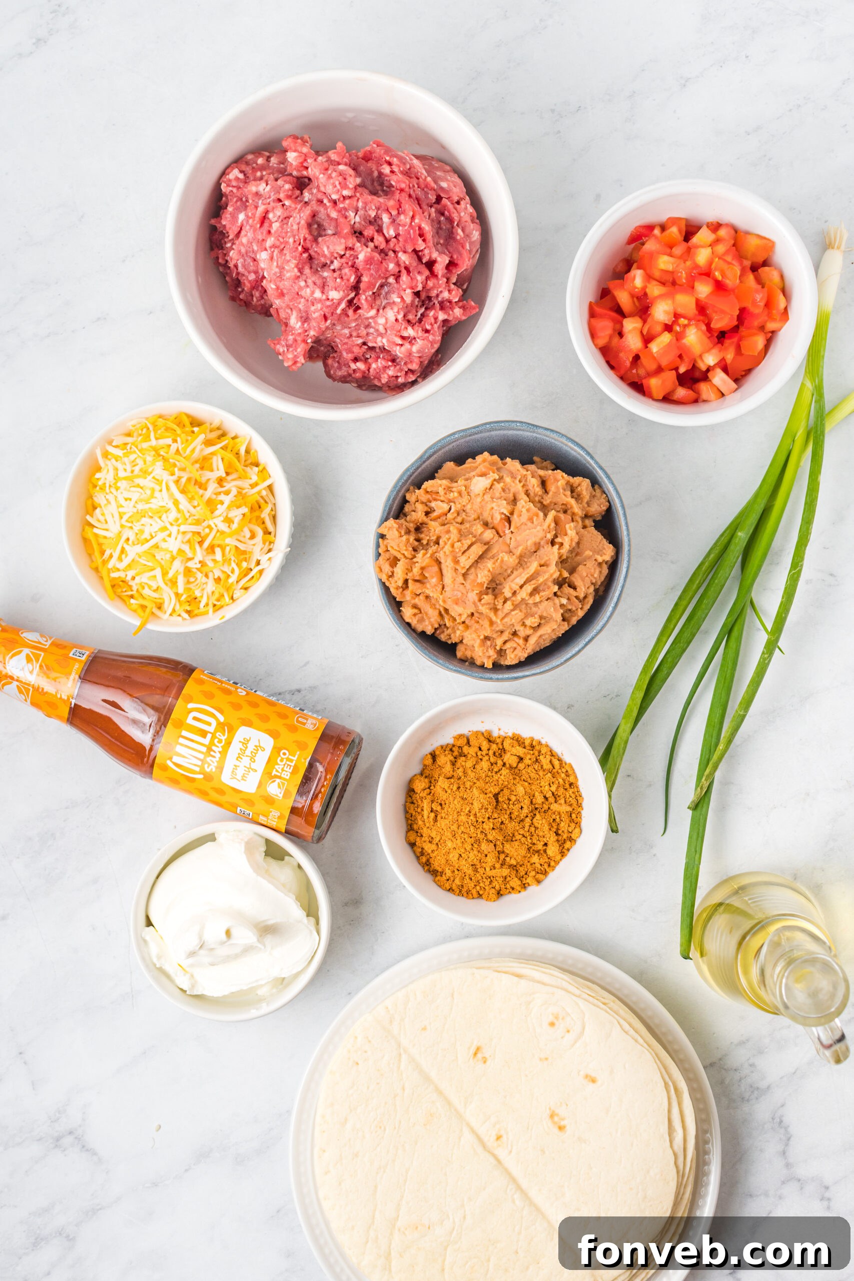 Overhead shot of ingredients needed to make Taco Bell Mexican Pizza. 