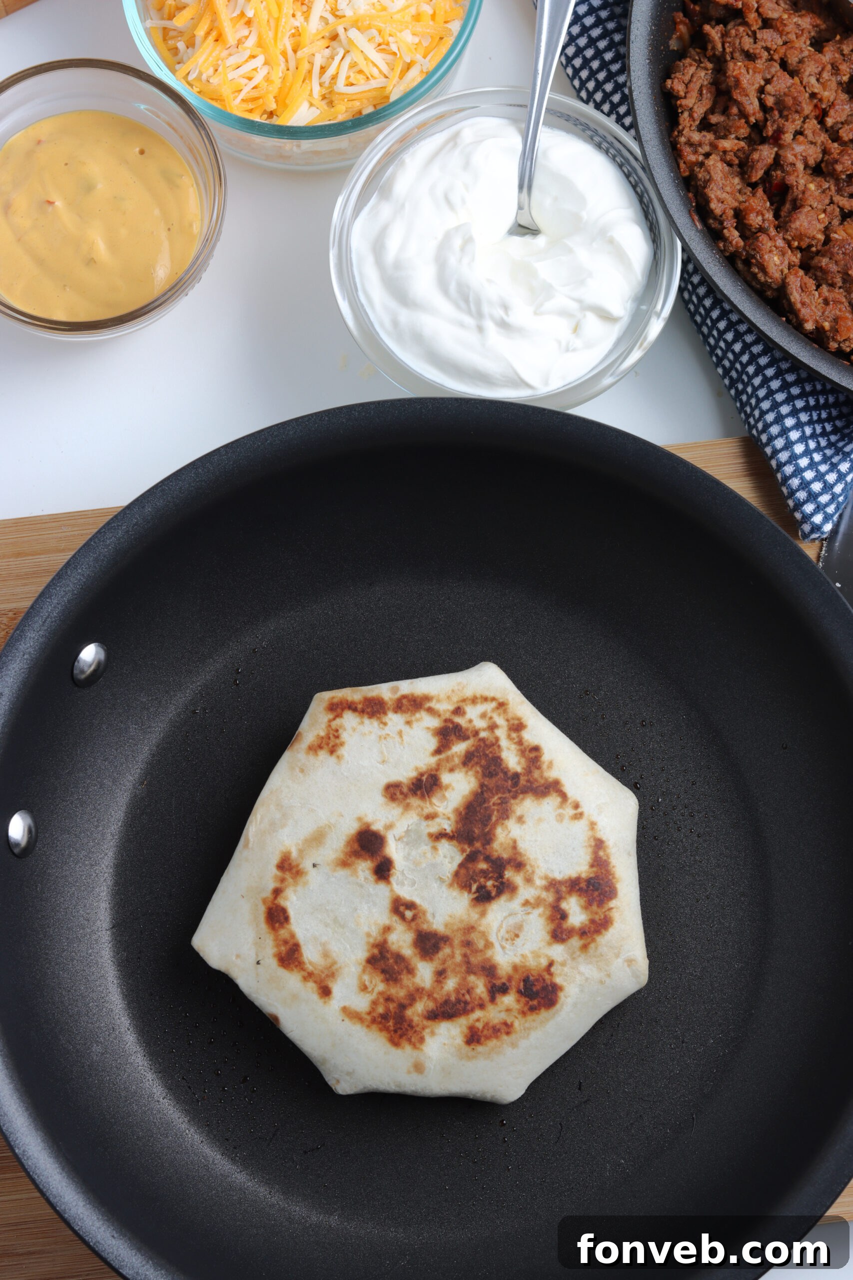 Ultimate Crispy Fold 12 The crucial step of folding the tortilla edges over the top, creating the signature hexagonal shape.