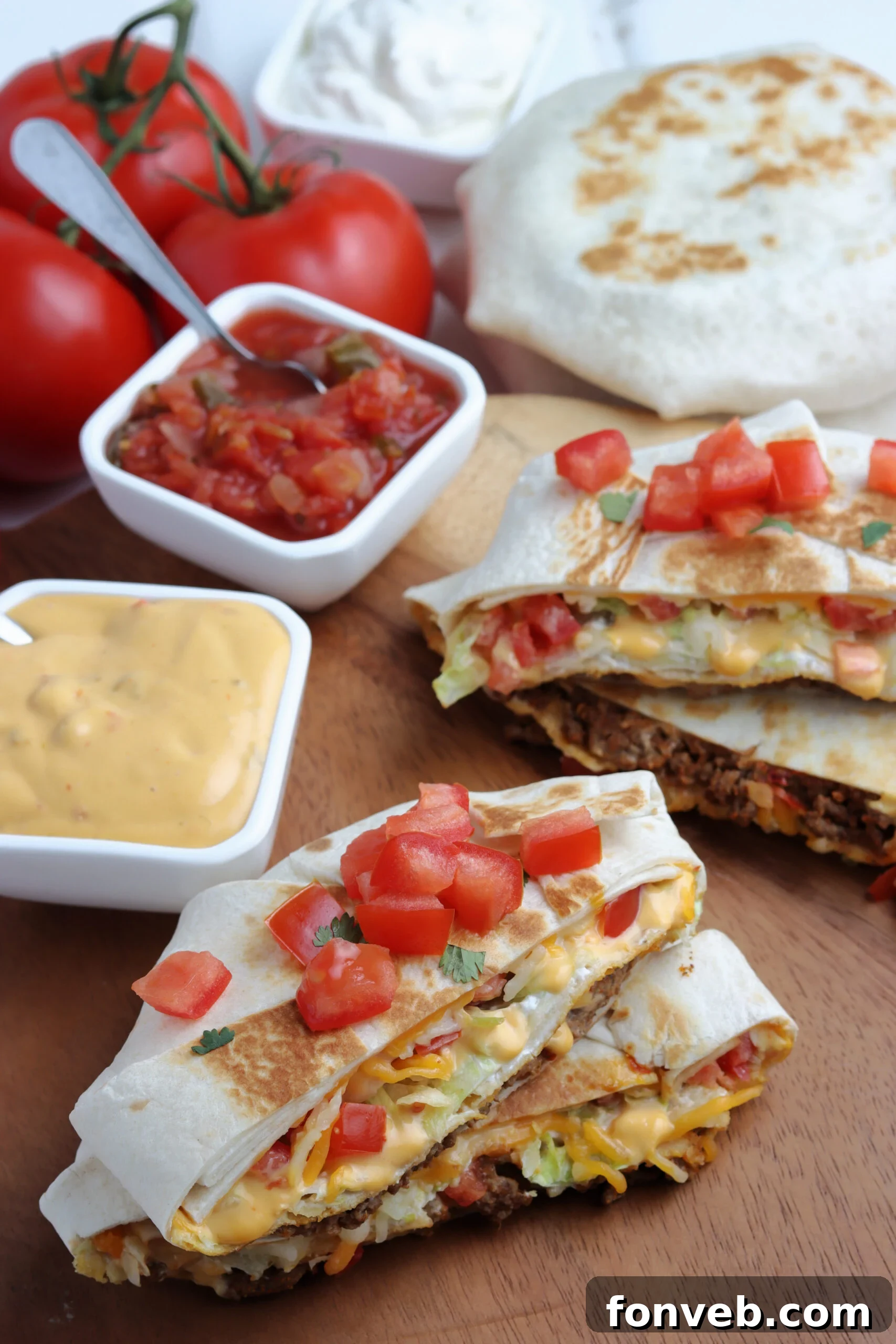 Ultimate Crispy Fold 4 A beautifully crafted crunch wrap, sliced in half to reveal the vibrant filling.