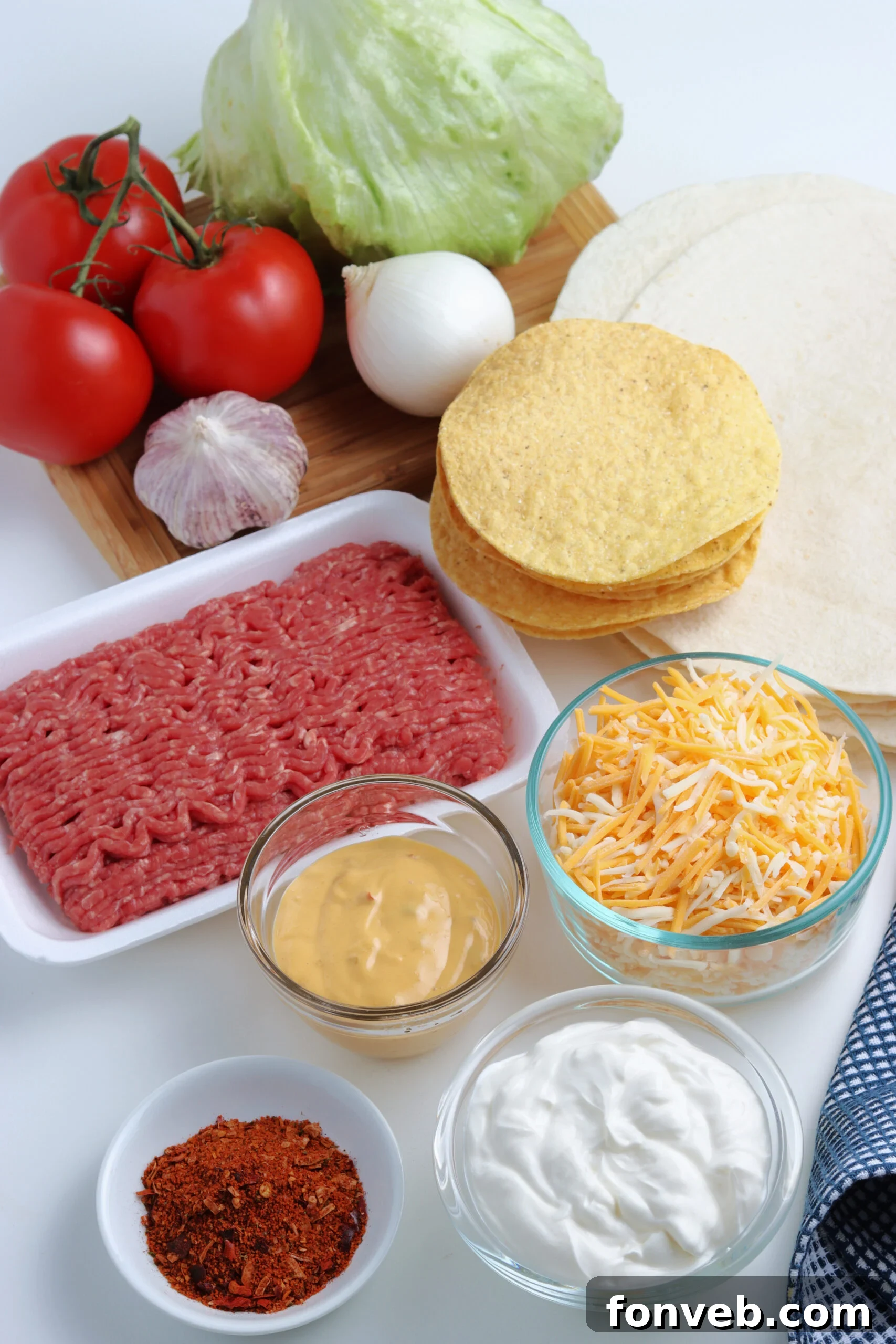 Ultimate Crispy Fold 6 An array of fresh ingredients laid out on a kitchen counter, ready to be assembled into homemade crunch wrap Supremes.