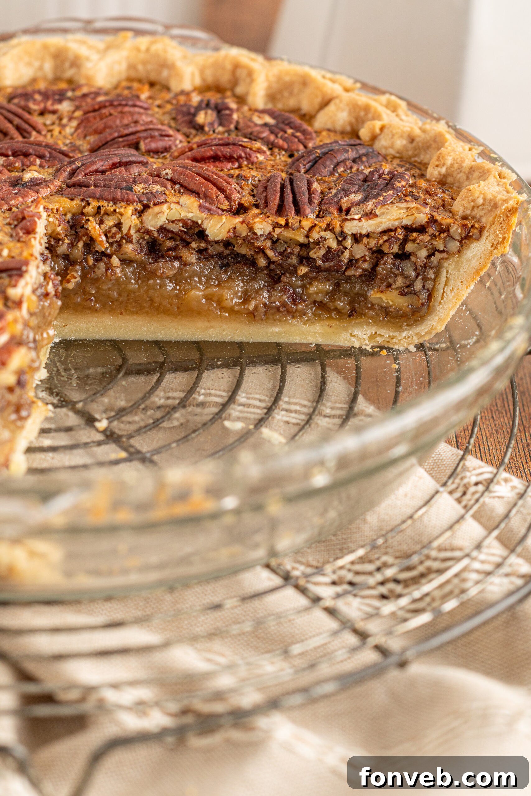Bourbon Pecan Indulgence 4 A center cut of the pecan pie in a glass pie dish.