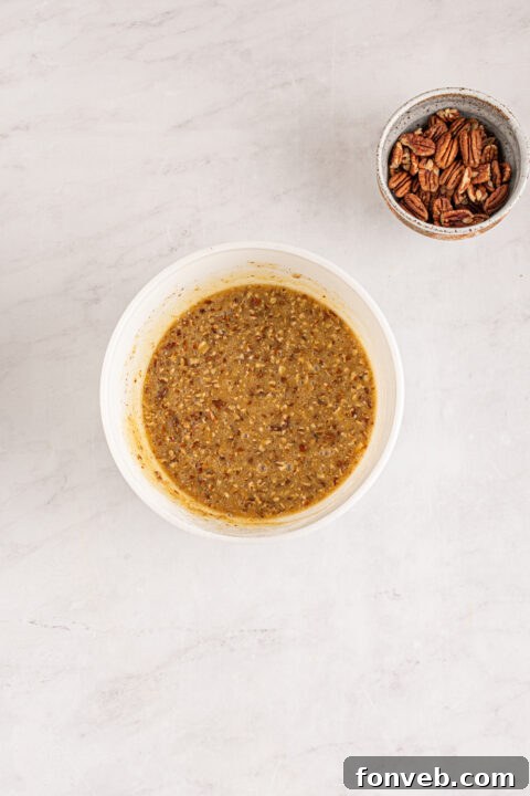 Bourbon Pecan Indulgence 9 Adding pecans to the filling