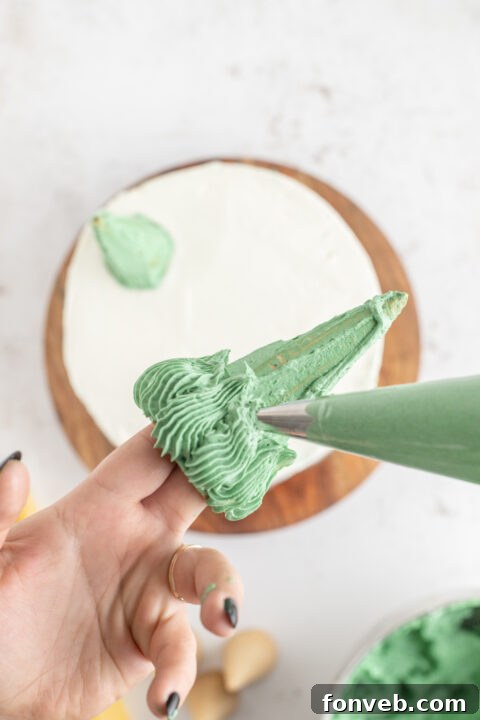 Decorated green Christmas tree cones with star piping.