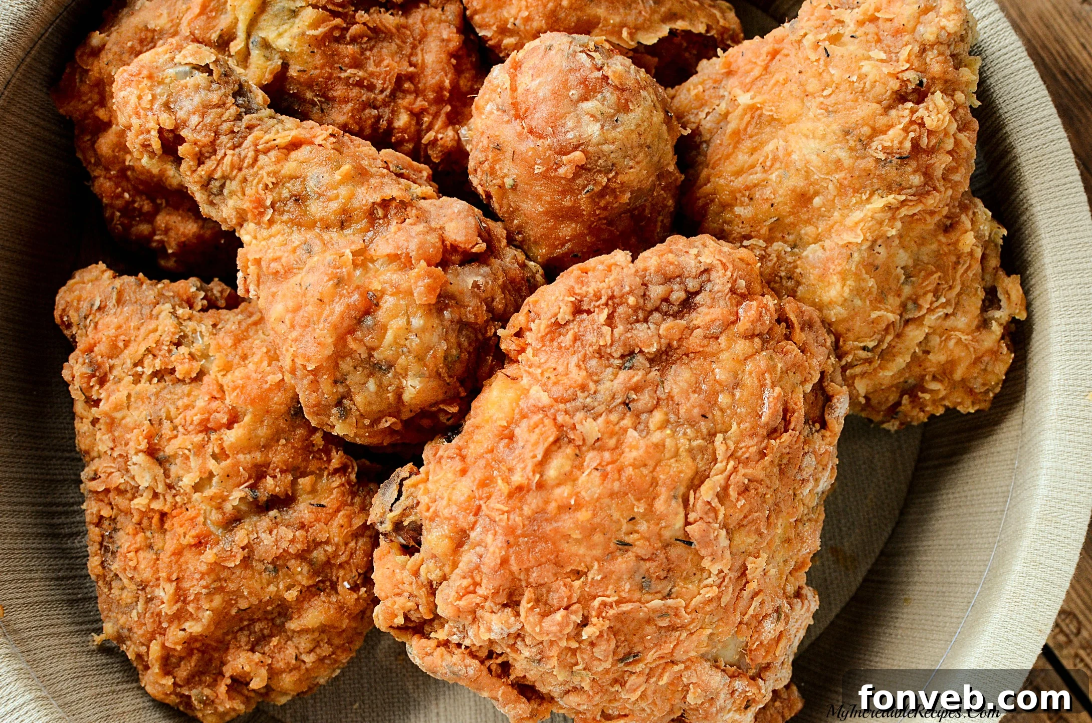 The Southern KFC Fried Chicken Secret Uncovered 9 Multiple pieces of fried chicken piled high, showcasing the abundance and inviting presentation.