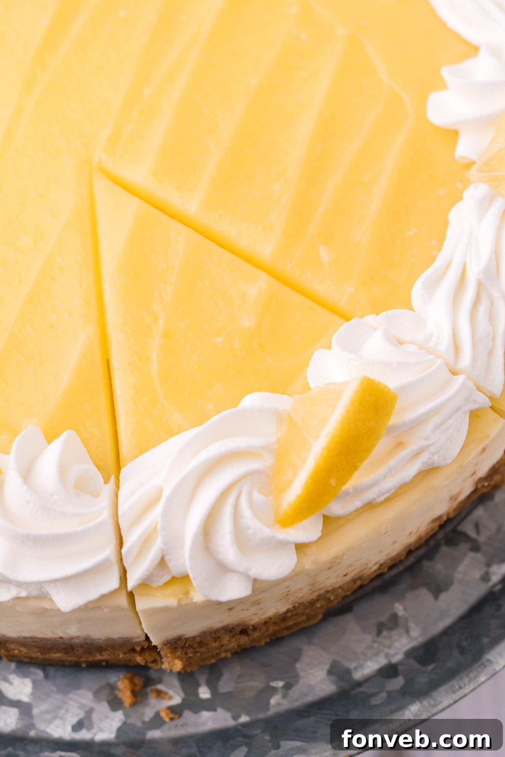 An overhead view of a slice of Lemon Curd Cheesecake.