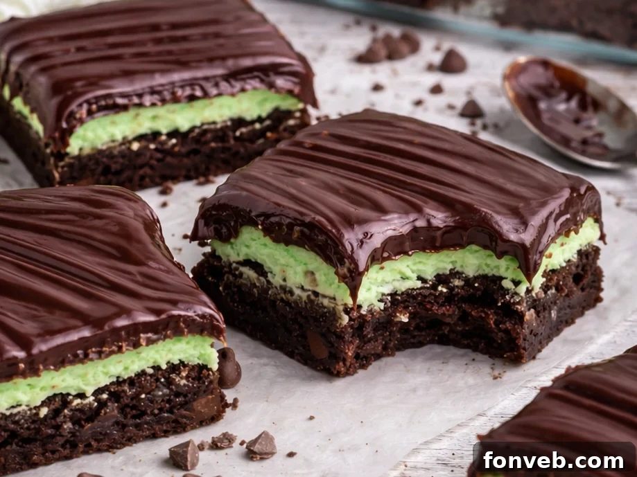 3 mint chocolate brownies on a white table