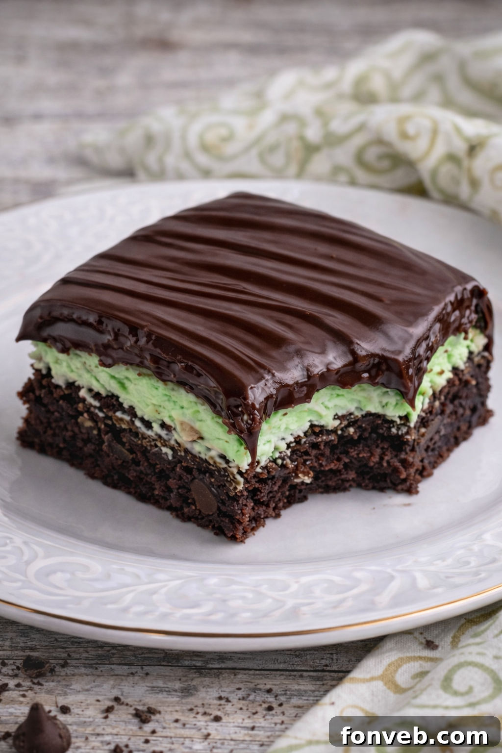 Up close view of a bite removed from the chocolate mint brownies.