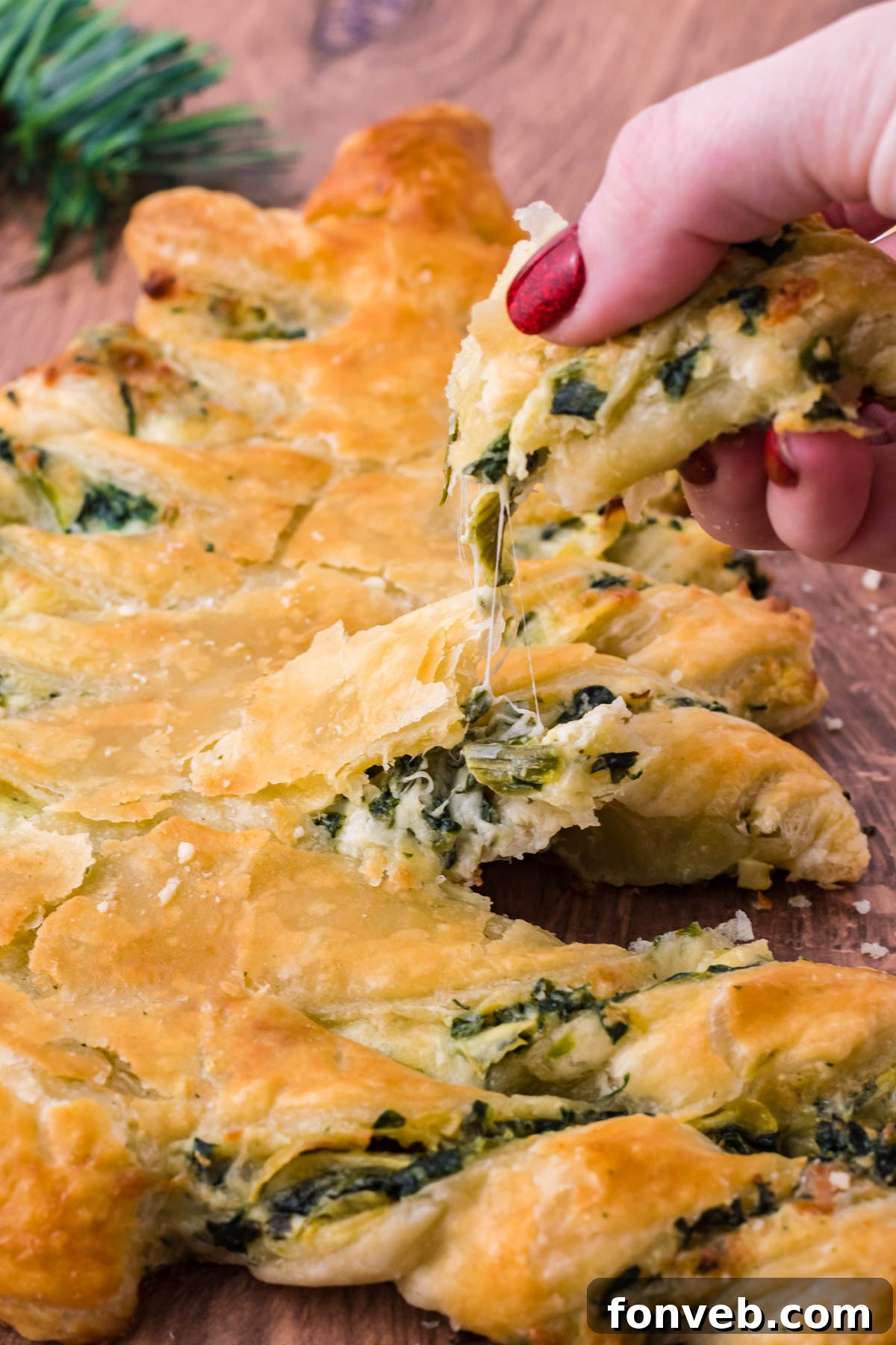 Tear and Share Christmas Spinach Artichoke Bread 5 Detailed shot of the twisted, golden-brown branches of the Spinach Artichoke Dip Pull Apart Christmas Tree, showcasing its textured crust and savory appeal.