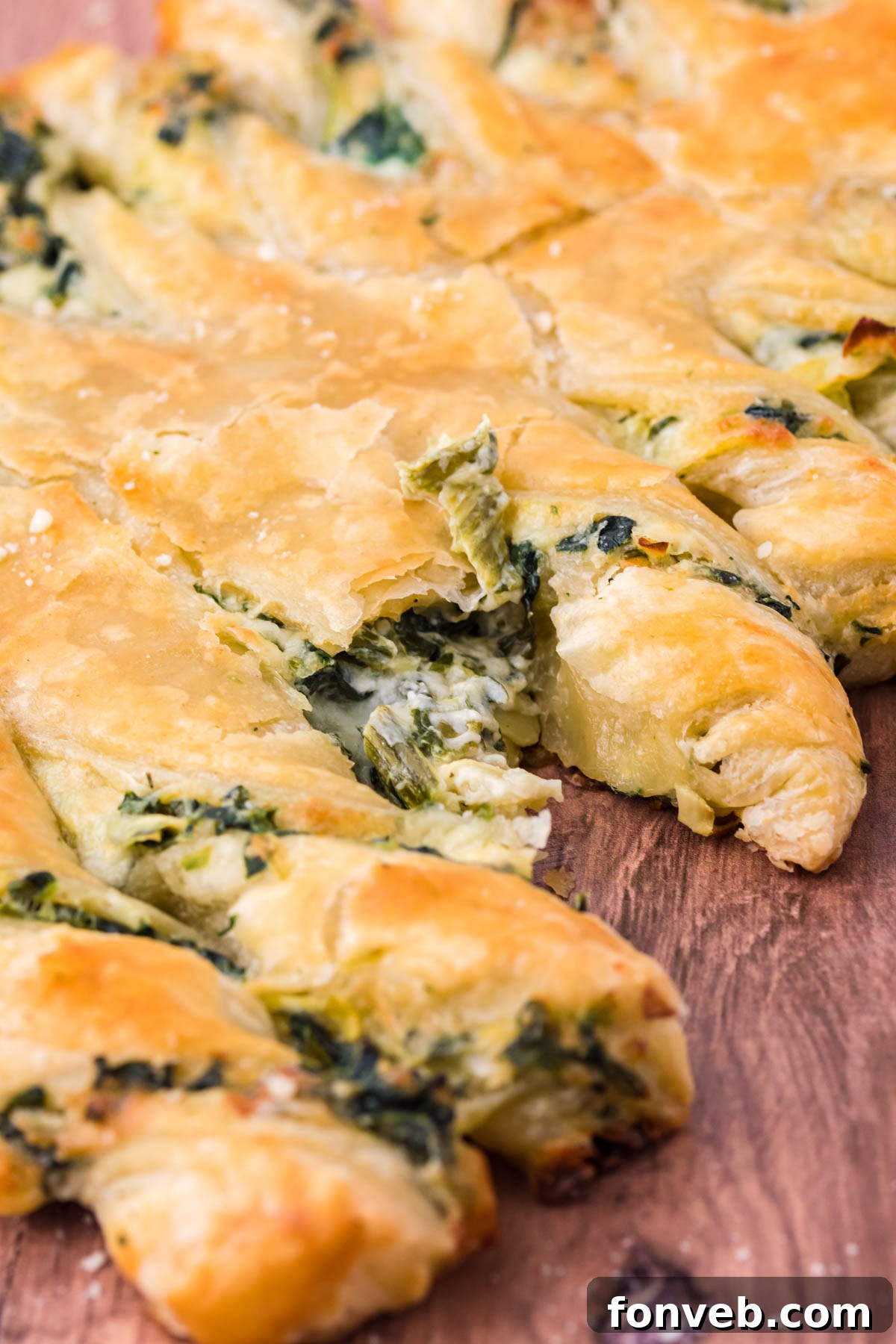 Tear and Share Christmas Spinach Artichoke Bread 6 Close-up photo of the creamy, vibrant green spinach artichoke dip filling, ready to be spread onto the puff pastry for the Christmas tree bread.